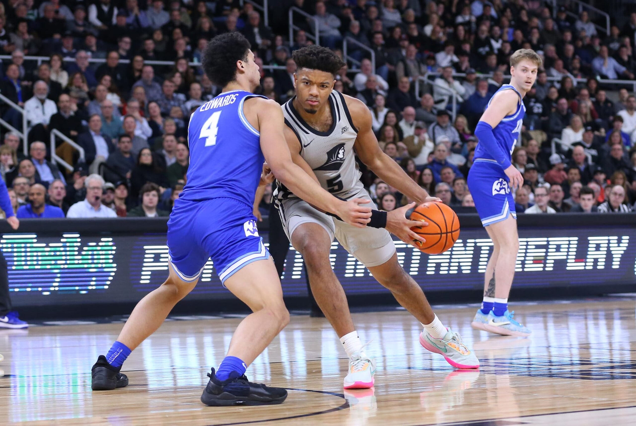 PROVIDENCE, RI - MARCH 01: Providence Friars forward Ed Croswell (5) and Xavier Musketeers forward Cesare Edwards (4) in action during the college basketball game between Xavier Musketeers and Providence Friars on March 1, 2023, at Amica Mutual Pavilion in Providence, RI. (Photo by M. Anthony Nesmith/Icon Sportswire via Getty Images) PROVIDENCE, RI - MARCH 01: Providence Friars forward Ed Croswell (5) and Xavier Musketeers forward Cesare Edwards (4) in action during the college basketball game between Xavier Musketeers and Providence Friars on March 1, 2023, at Amica Mutual Pavilion in Providence, RI. (Photo by M. Anthony Nesmith/Icon Sportswire via Getty Images)