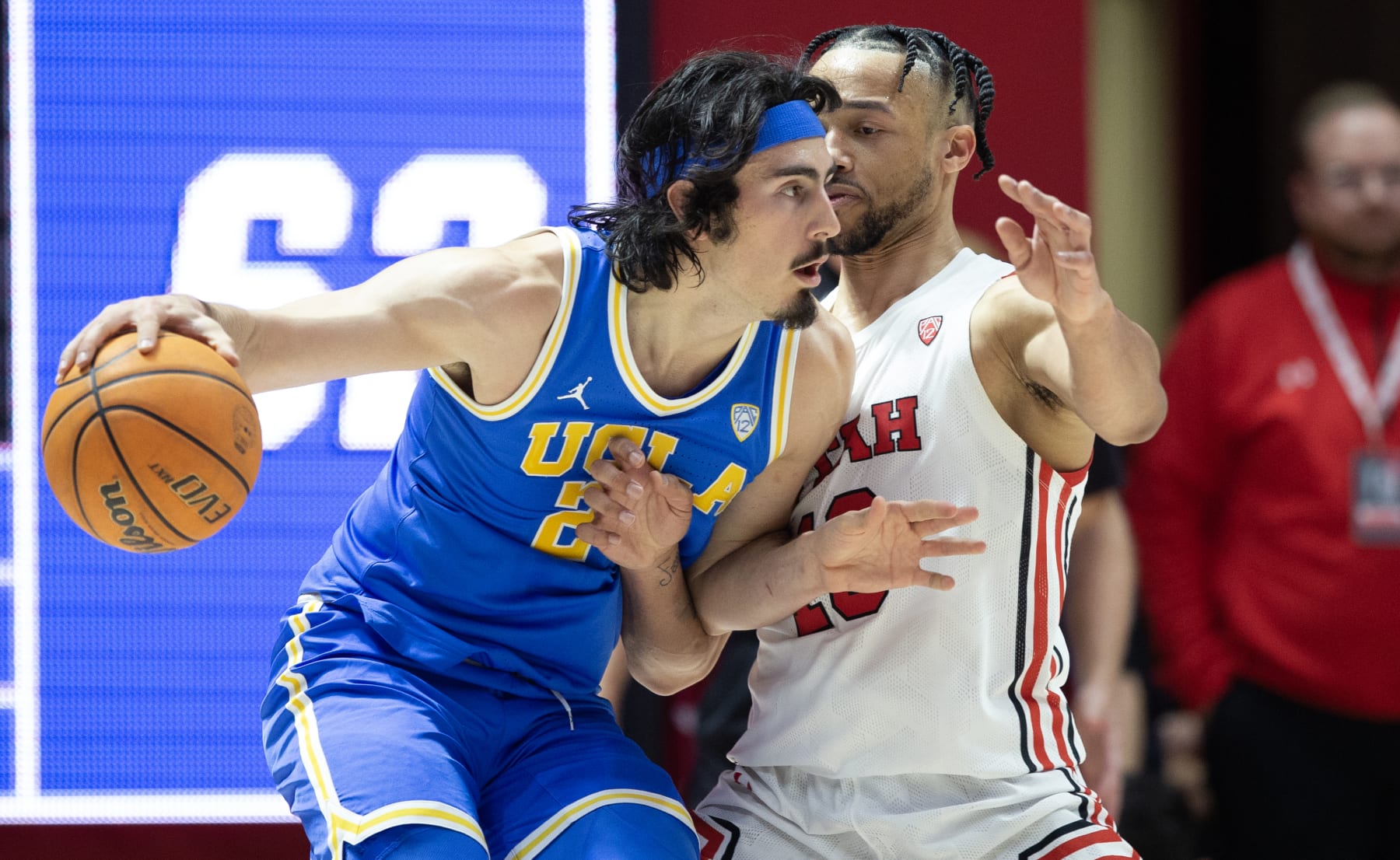 SALT LAKE CITY, UT - FEBRUARY 23: Jaime Jaquez Jr., #24 of the UCLA Bruins pushes past Marco Anthony #10 of the Utah Utes during the second half of their game at the Jon M Huntsman Center on February 23, 2023 in Salt Lake City, Utah. (Photo by Chris Gardner/Getty Images)