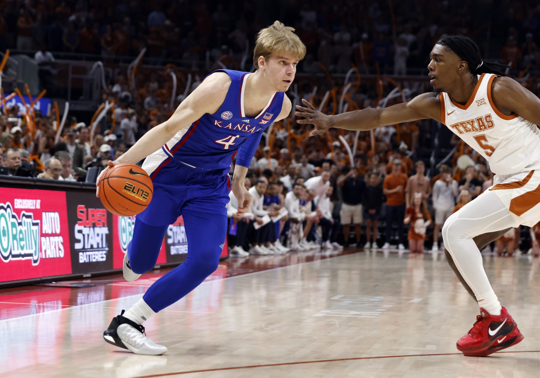 AUSTIN, TX - MARCH 04: Kansas Jayhawks guard Grady Dick (4) dribbles Texas Longhorns guard Marcus Carr (5) during the game at the Moody Center in Austin, TX on March 04, 2023. (Photo by Adam Davis/Icon Sportswire via Getty Images)