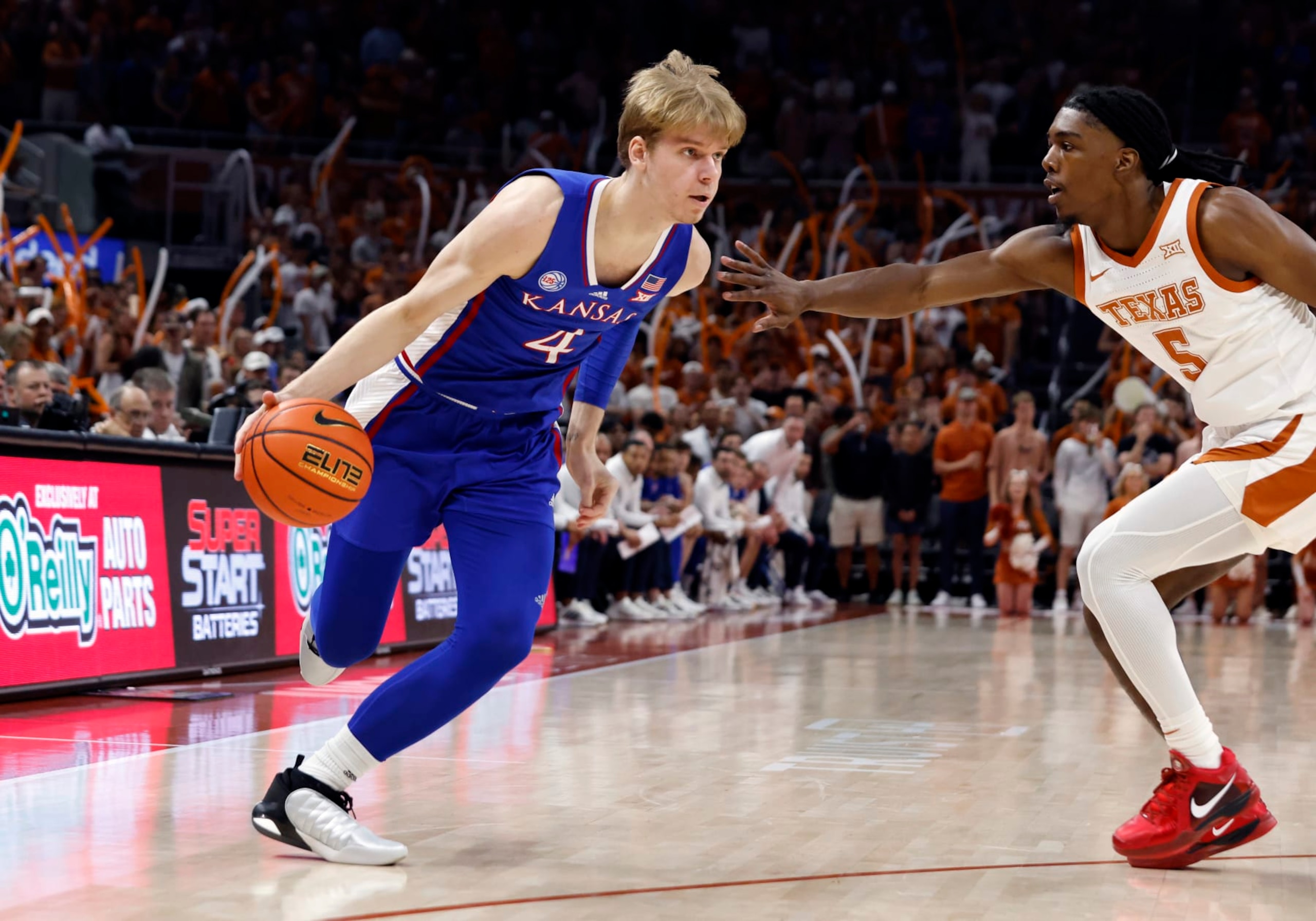 AUSTIN, TX - MARCH 04: Kansas Jayhawks guard Grady Dick (4) dribbles Texas Longhorns guard Marcus Carr (5) during the game at the Moody Center in Austin, TX on March 04, 2023. (Photo by Adam Davis/Icon Sportswire via Getty Images)
