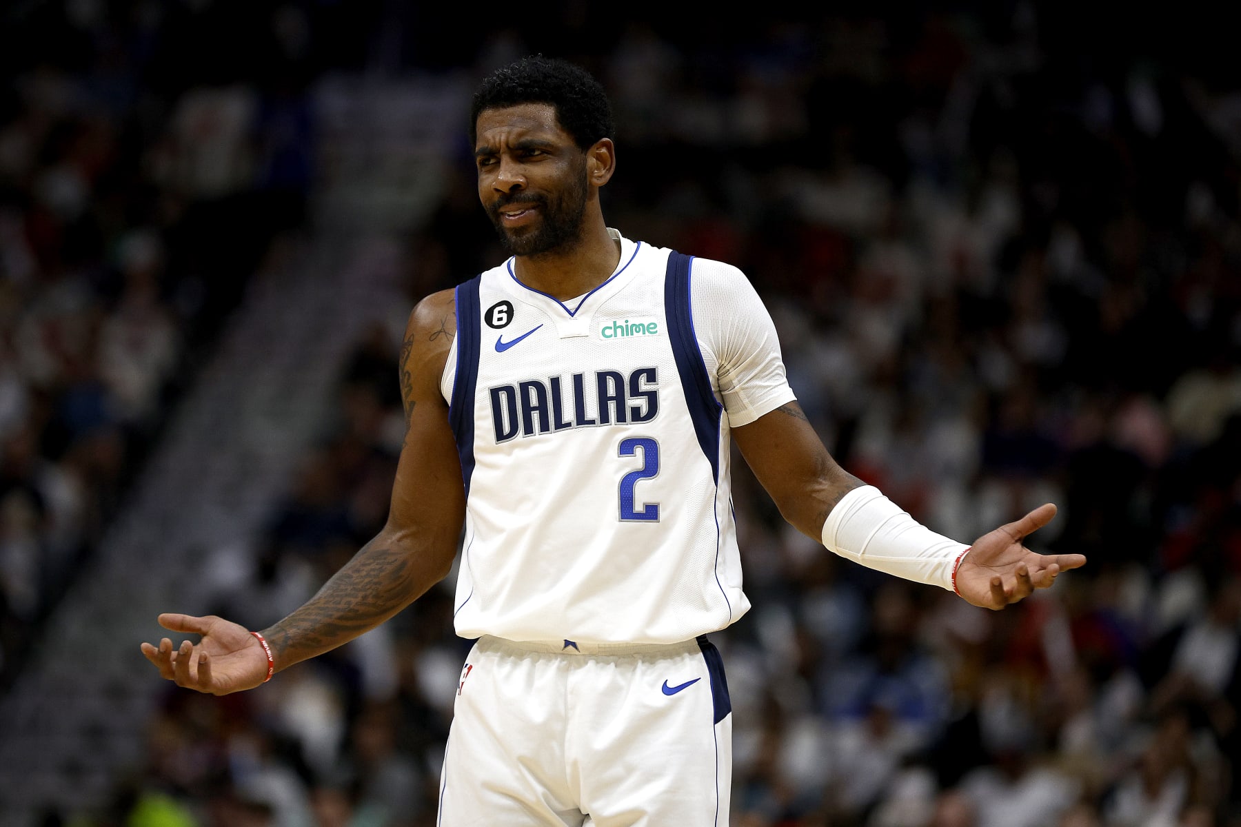 NEW ORLEANS, LOUISIANA - MARCH 08: Kyrie Irving #2 of the Dallas Mavericks reacts to a fan during the second quarter of an NBA game against the New Orleans Pelicans at Smoothie King Center on March 08, 2023 in New Orleans, Louisiana. NOTE TO USER: User expressly acknowledges and agrees that, by downloading and or using this photograph, User is consenting to the terms and conditions of the Getty Images License Agreement. (Photo by Sean Gardner/Getty Images)