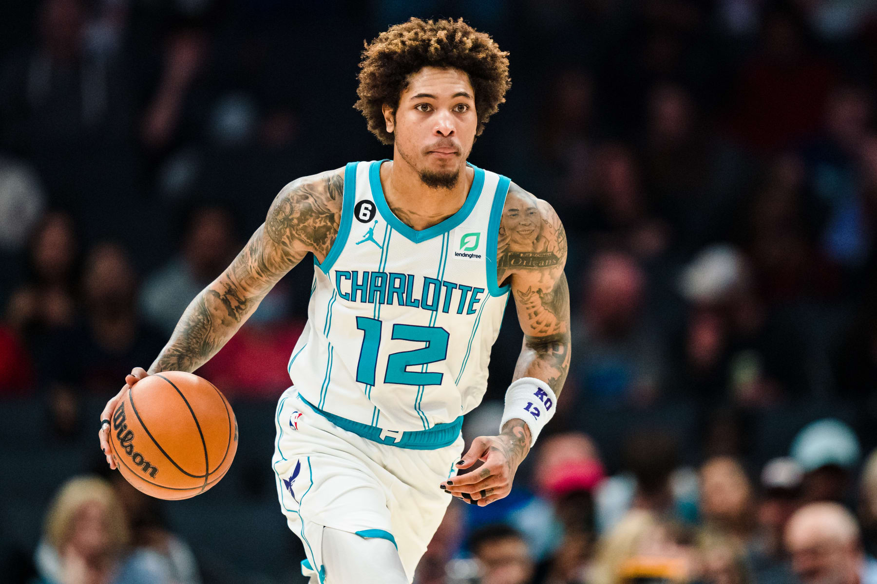 CHARLOTTE, NORTH CAROLINA - MARCH 03: Kelly Oubre Jr. #12 of the Charlotte Hornets brings the ball up court against the Orlando Magic during their game at Spectrum Center on March 03, 2023 in Charlotte, North Carolina. NOTE TO USER: User expressly acknowledges and agrees that, by downloading and or using this photograph, User is consenting to the terms and conditions of the Getty Images License Agreement. (Photo by Jacob Kupferman/Getty Images)
