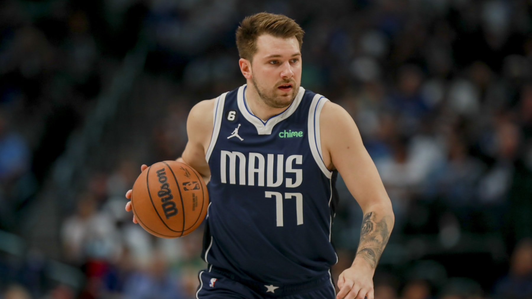 Dallas Mavericks guard Luka Doncic (77) runs the court during an NBA basketball game against the Phoenix Suns, Sunday, March 5, 2023, in Dallas. (AP Photo/Gareth Patterson)