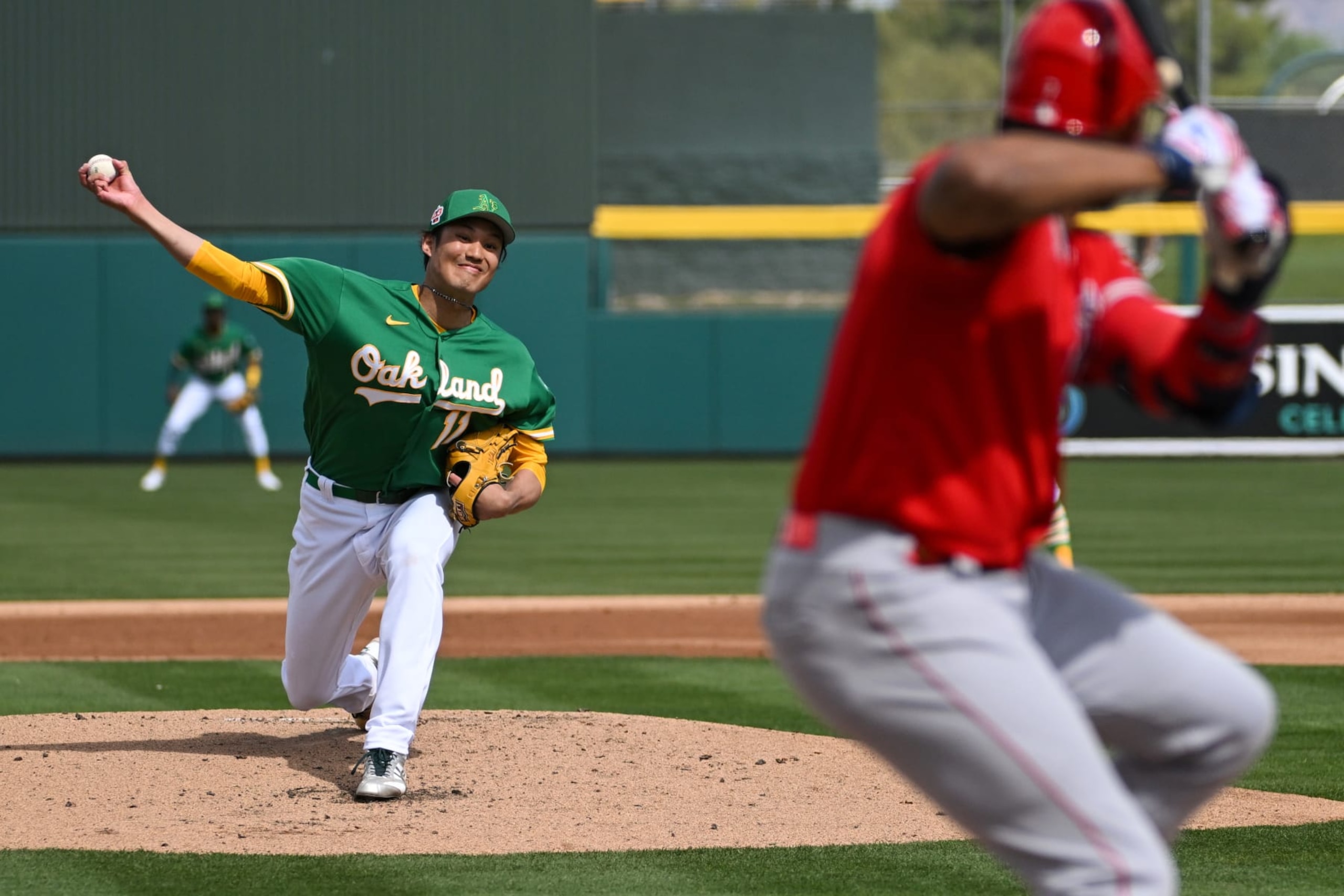 MESA, ARIZONA - FEBRUARY 28, 2023: Shintaro Fujinami #11 of the Oakland Athletics throws a pitch during the second inning of a spring training game against the Los Angeles Angels at Hohokam Stadium on February 28, 2023 in Mesa, Arizona. (Photo by David Durochik/Diamond Images via Getty Images)
