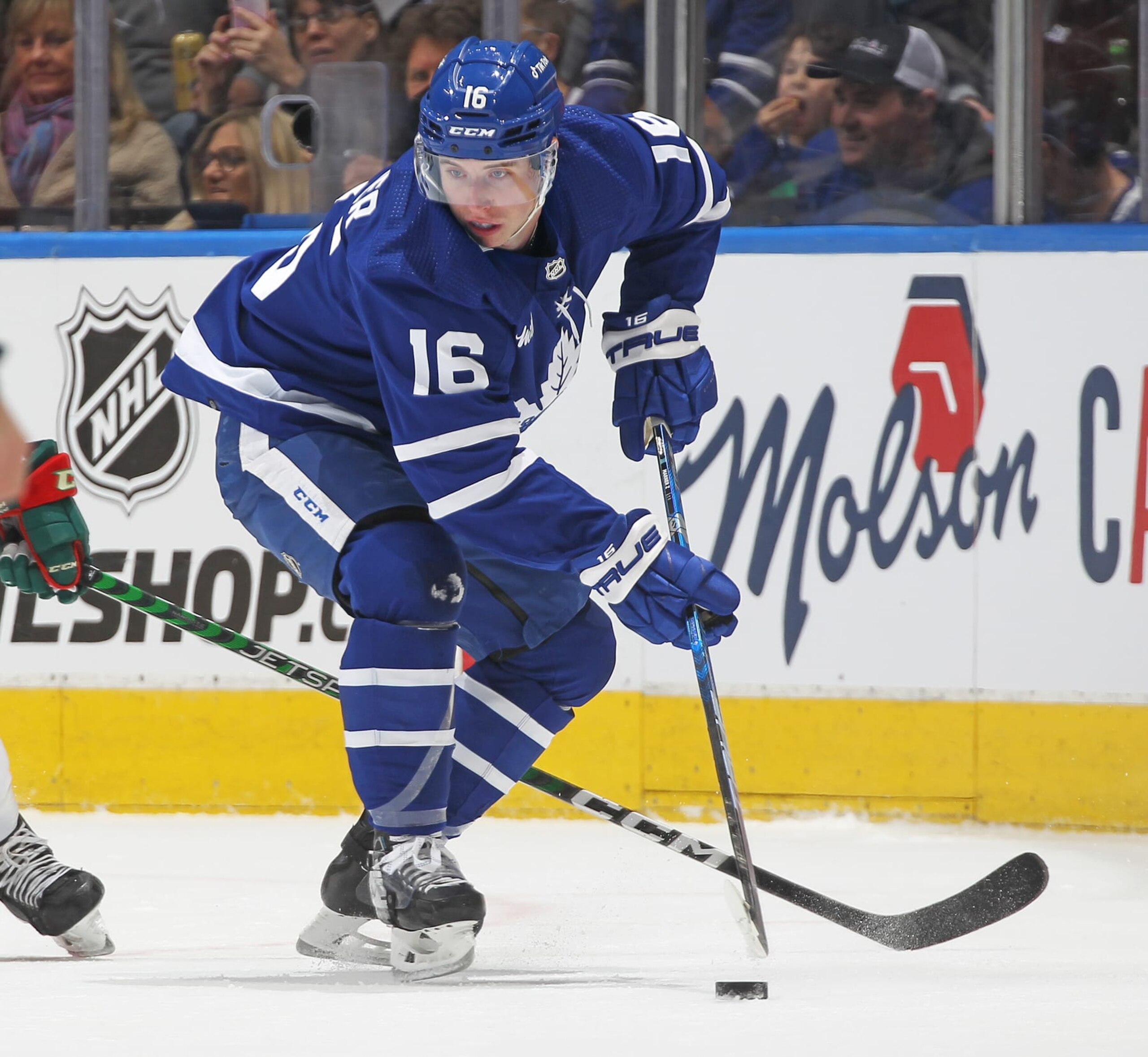 TORONTO, CANADA - FEBRUARY 24:  Mitchell Marner #16 of the Toronto Maple Leafs controls the puck against the Minnesota Wild during an NHL game at Scotiabank Arena on February 24, 2023 in Toronto, Ontario, Canada. (Photo by Claus Andersen/Getty images)