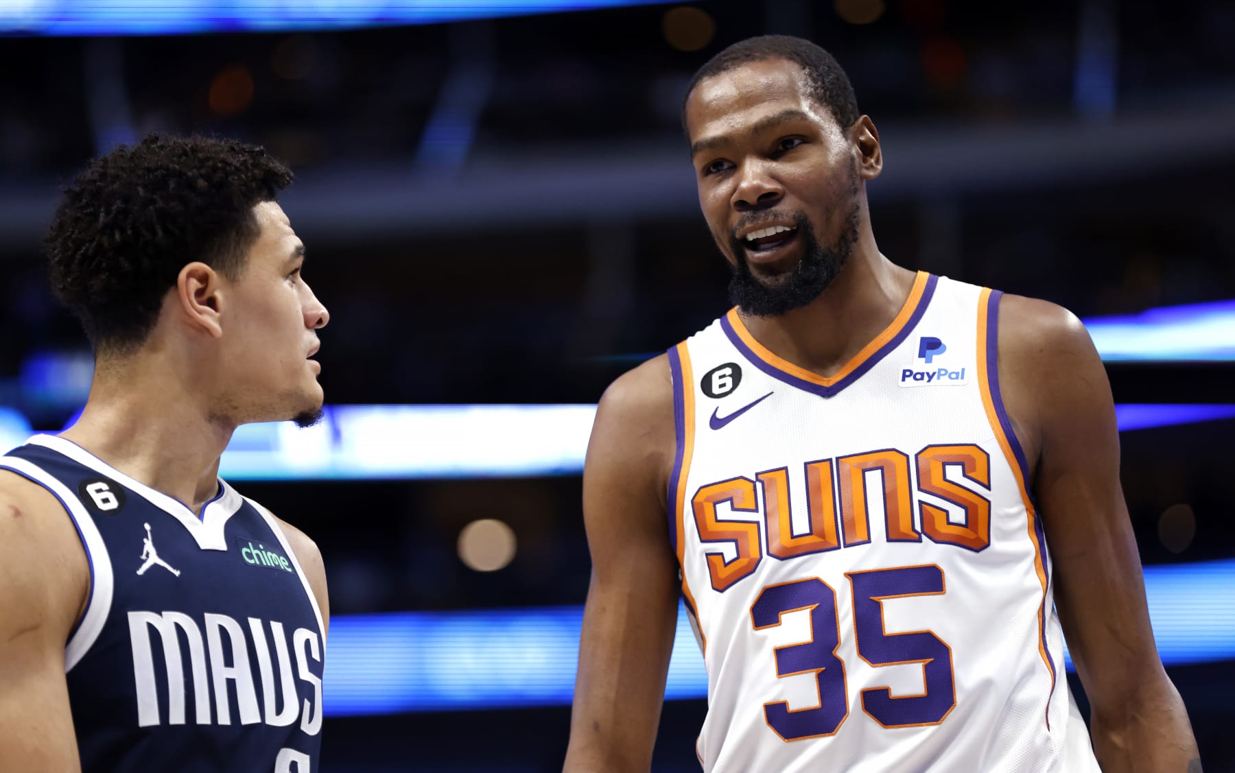 DALLAS, TX - MARCH 5: Kevin Durant #35 of the Phoenix Suns and Josh Green #8 of the Dallas Mavericks talk during a break in the action during the first half of the game at American Airlines Center on March 5, 2023 in Dallas, Texas. NOTE TO USER: User expressly acknowledges and agrees that, by downloading and or using this photograph, User is consenting to the terms and conditions of the Getty Images License Agreement. (Photo by Ron Jenkins/Getty Images)