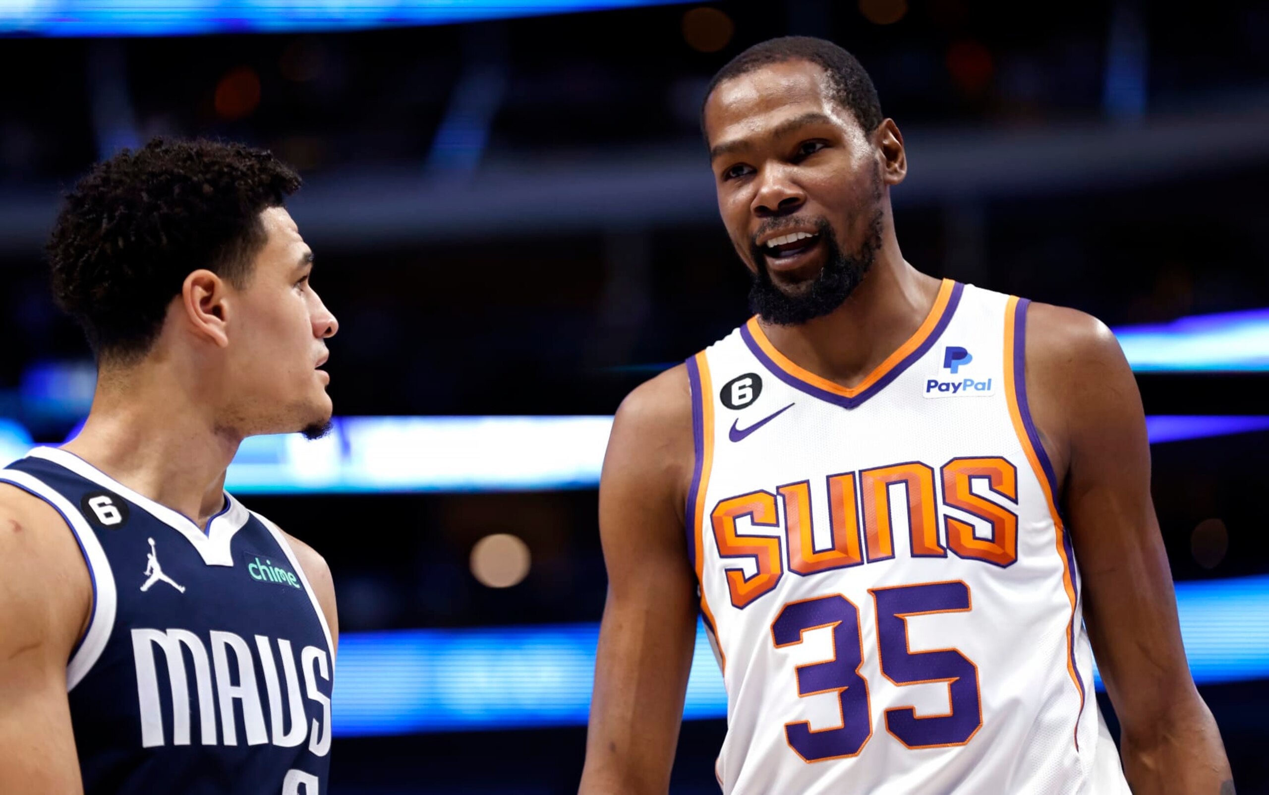 DALLAS, TX - MARCH 5: Kevin Durant #35 of the Phoenix Suns and Josh Green #8 of the Dallas Mavericks talk during a break in the action during the first half of the game at American Airlines Center on March 5, 2023 in Dallas, Texas. NOTE TO USER: User expressly acknowledges and agrees that, by downloading and or using this photograph, User is consenting to the terms and conditions of the Getty Images License Agreement. (Photo by Ron Jenkins/Getty Images)