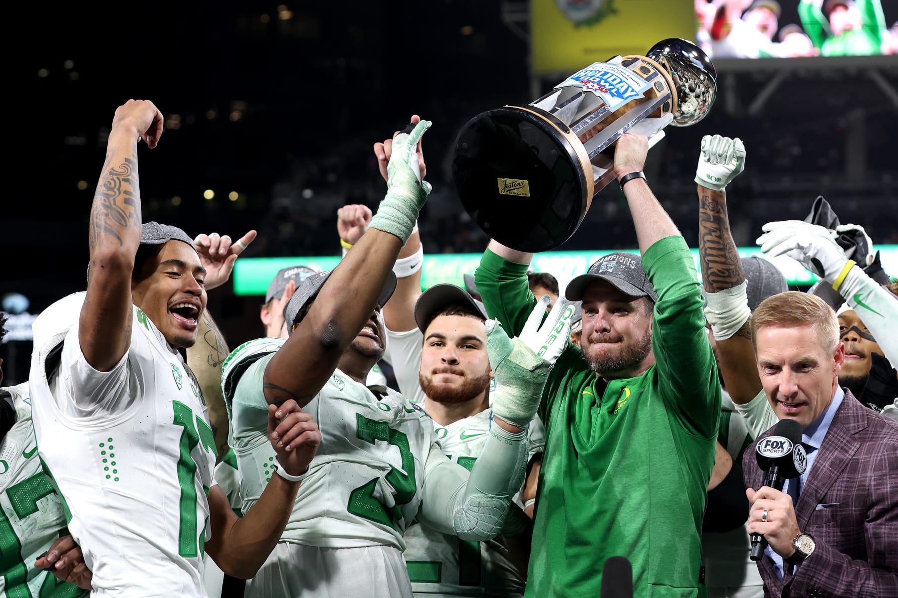 SAN DIEGO, CALIFORNIA - DECEMBER 28: Head coach Dan Lanning of the Oregon Ducks holds up the Holiday Bowl trophy after defeating the North Carolina Tar Heels 28-27 in the San Diego Credit Union Holiday Bowl game at PETCO Park on December 28, 2022 in San Diego, California. (Photo by Sean M. Haffey/Getty Images)