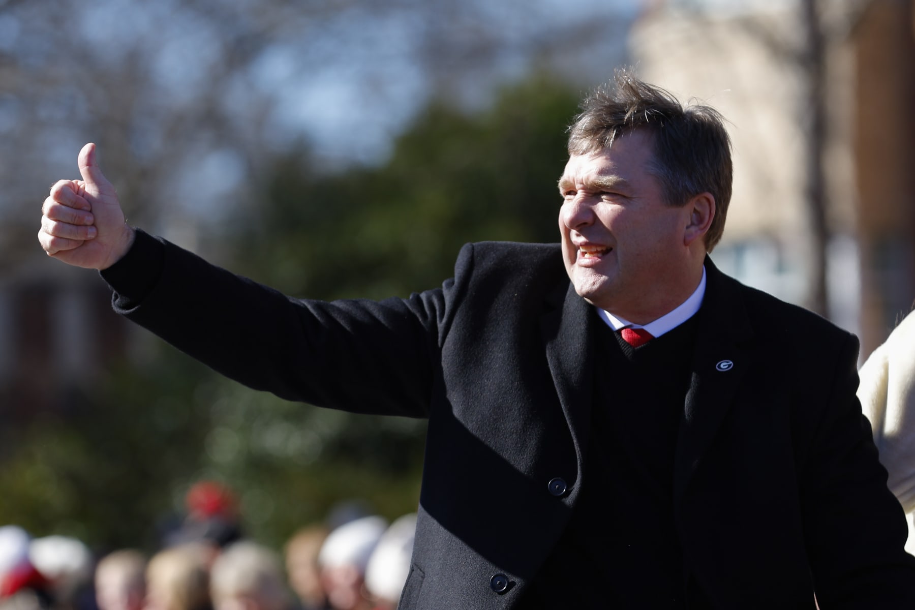 ATHENS, GA - JANUARY 14: Head coach Kirby Smart of the Georgia Bulldogs waves to fans during the parade honoring the Georgia Bulldogs national championship victory on January 14, 2023 in Athens, Georgia. (Photo by Todd Kirkland/Getty Images)