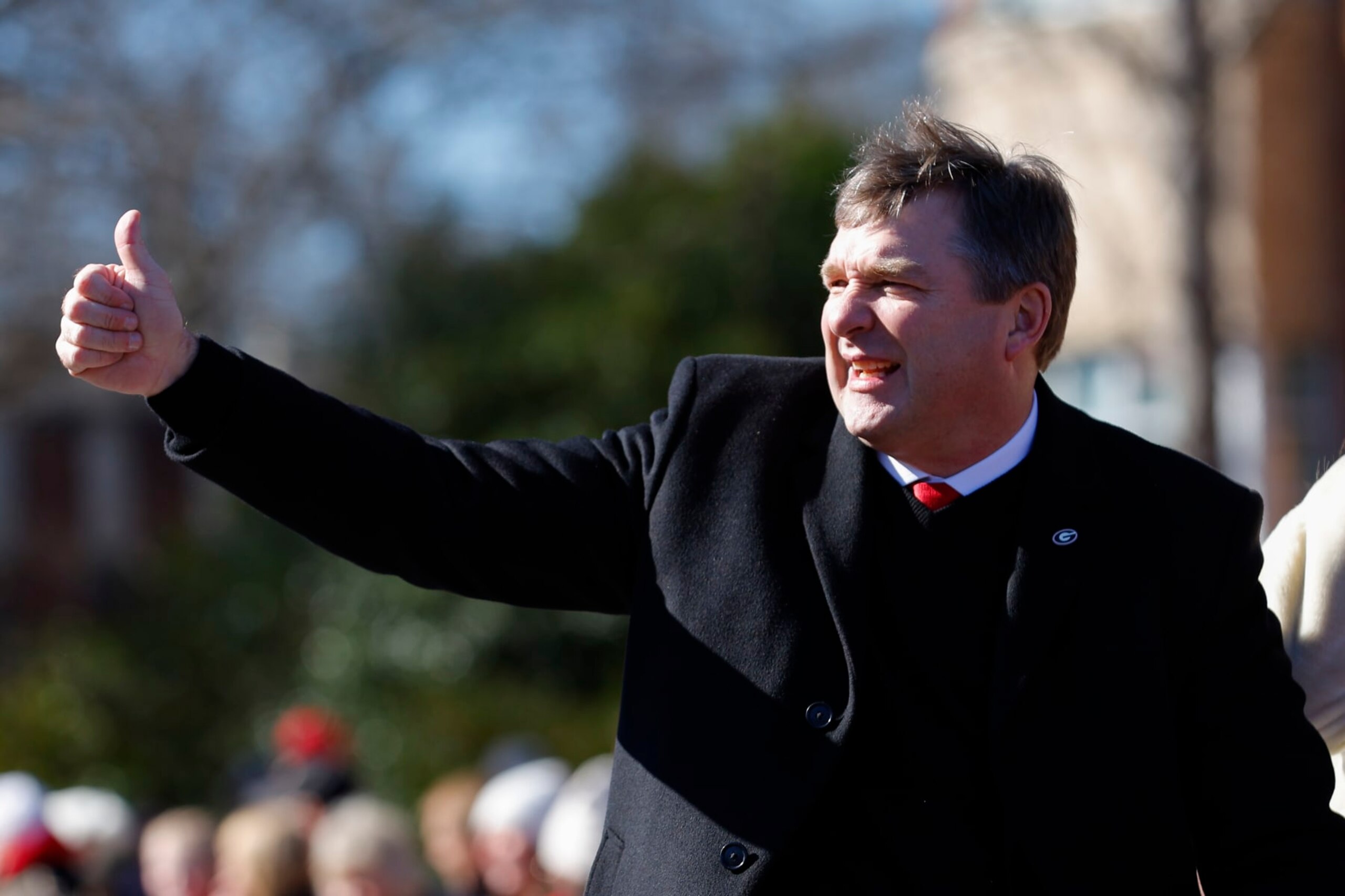 ATHENS, GA - JANUARY 14: Head coach Kirby Smart of the Georgia Bulldogs waves to fans during the parade honoring the Georgia Bulldogs national championship victory on January 14, 2023 in Athens, Georgia. (Photo by Todd Kirkland/Getty Images)