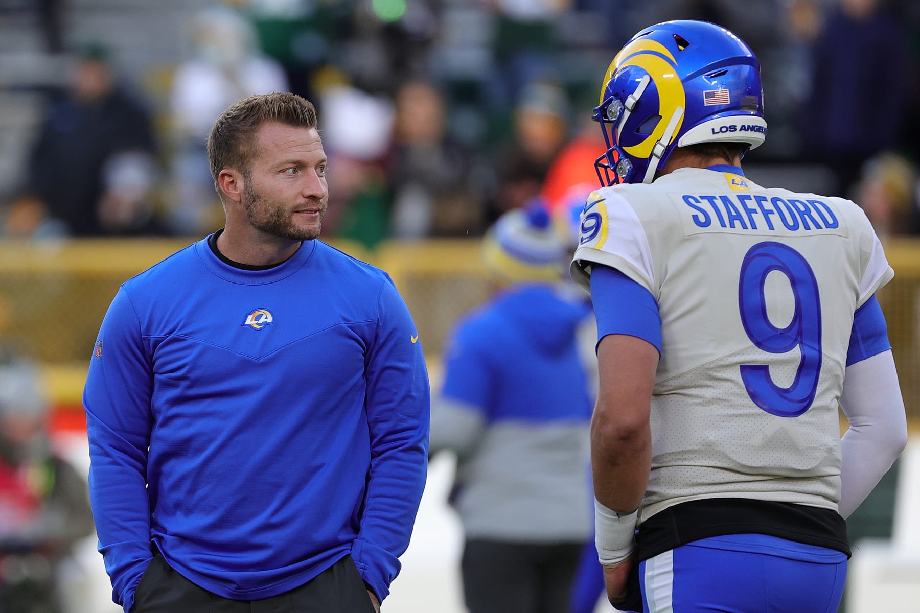 GREEN BAY, WISCONSIN - NOVEMBER 28: Head coach Sean McVay of the Los Angeles Rams speaks with Matthew Stafford #9 prior to a game against the Green Bay Packers at Lambeau Field on November 28, 2021 in Green Bay, Wisconsin.  The Packers defeated the Rams 36-28.   (Photo by Stacy Revere/Getty Images)