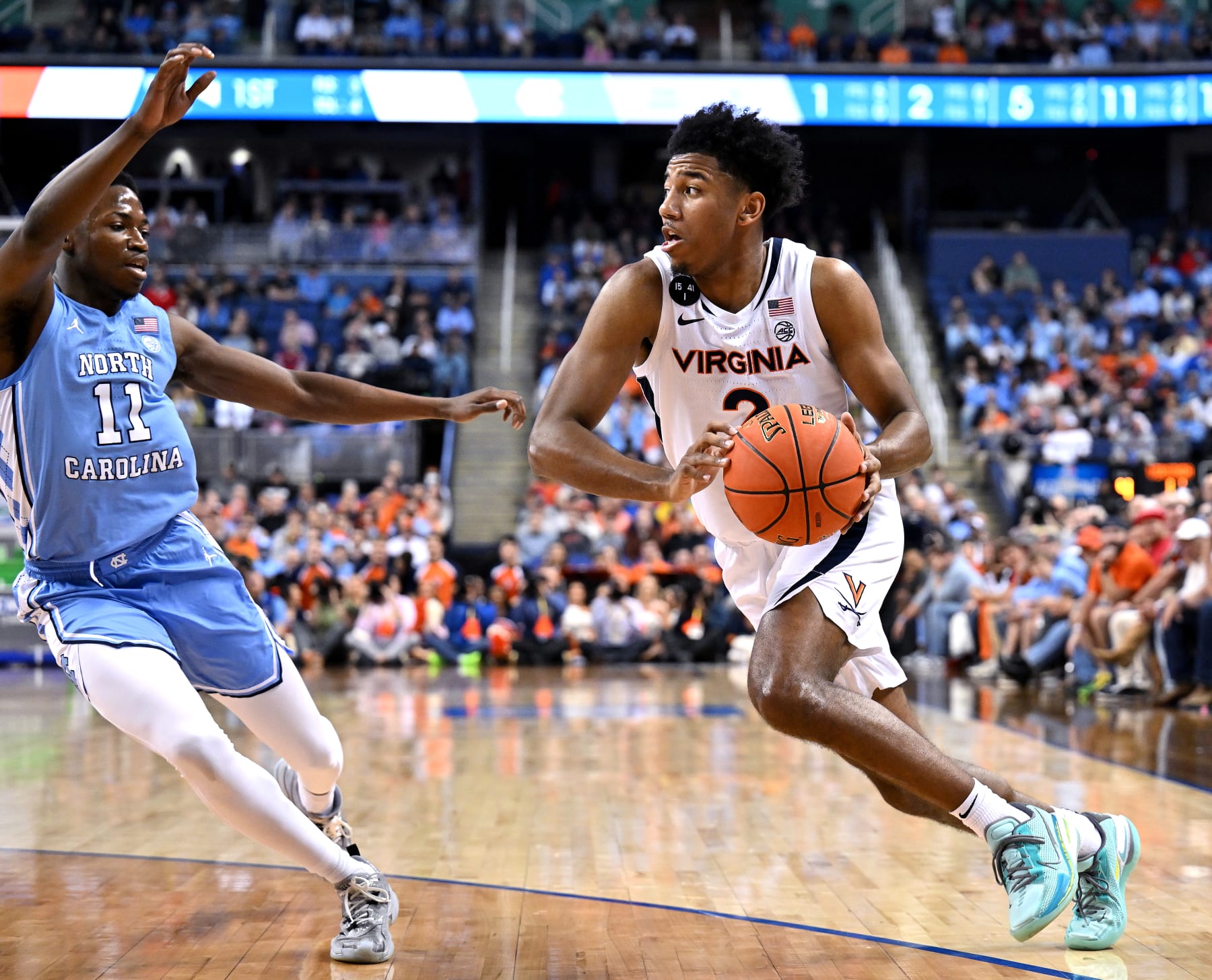 GREENSBORO, NORTH CAROLINA - MARCH 09: Reece Beekman #2 of the Virginia Cavaliers drives against D'Marco Dunn #11 of the North Carolina Tar Heels during the first half in the quarterfinals of the ACC Basketball Tournament at Greensboro Coliseum on March 09, 2023 in Greensboro, North Carolina. (Photo by Grant Halverson/Getty Images)