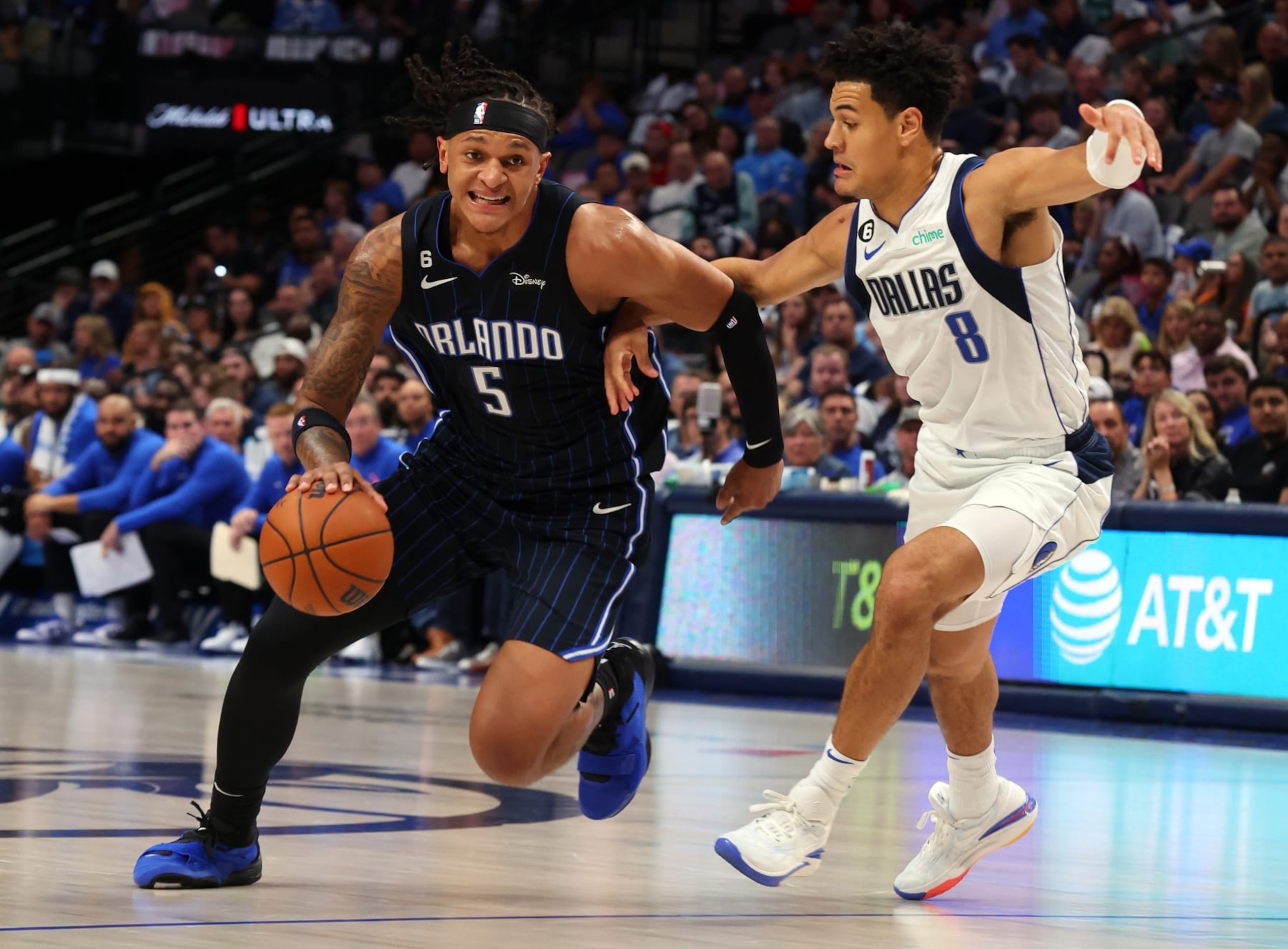 DALLAS, TEXAS - OCTOBER 30: Paolo Banchero #5 of the Orlando Magic drives against Josh Green #8 of the Dallas Mavericks in the first half at American Airlines Center on October 30, 2022 in Dallas, Texas. NOTE TO USER: User expressly acknowledges and agrees that, by downloading and/or using this Photograph, user is consenting to the terms and conditions of the Getty Images License Agreement. (Photo by Richard Rodriguez/Getty Images) DALLAS, TEXAS - OCTOBER 30: Paolo Banchero #5 of the Orlando Magic drives against Josh Green #8 of the Dallas Mavericks in the first half at American Airlines Center on October 30, 2022 in Dallas, Texas. NOTE TO USER: User expressly acknowledges and agrees that, by downloading and/or using this Photograph, user is consenting to the terms and conditions of the Getty Images License Agreement. (Photo by Richard Rodriguez/Getty Images)