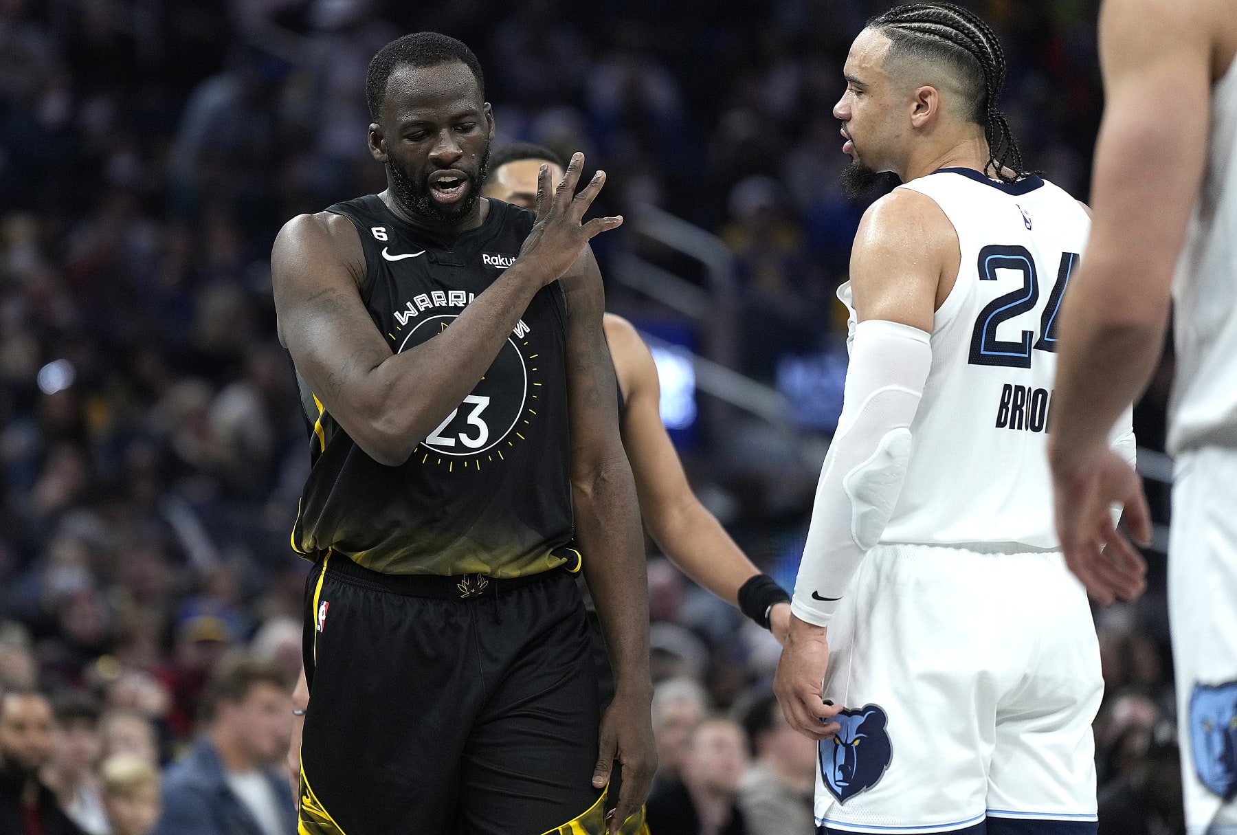 SAN FRANCISCO, CALIFORNIA - DECEMBER 25: Draymond Green #23 of the Golden State Warriors and Dillon Brooks #24 of the Memphis Grizzlies exchange word with each other during the second quarter at Chase Center on December 25, 2022 in San Francisco, California. NOTE TO USER: User expressly acknowledges and agrees that, by downloading and or using this photograph, User is consenting to the terms and conditions of the Getty Images License Agreement. (Photo by Thearon W. Henderson/Getty Images)