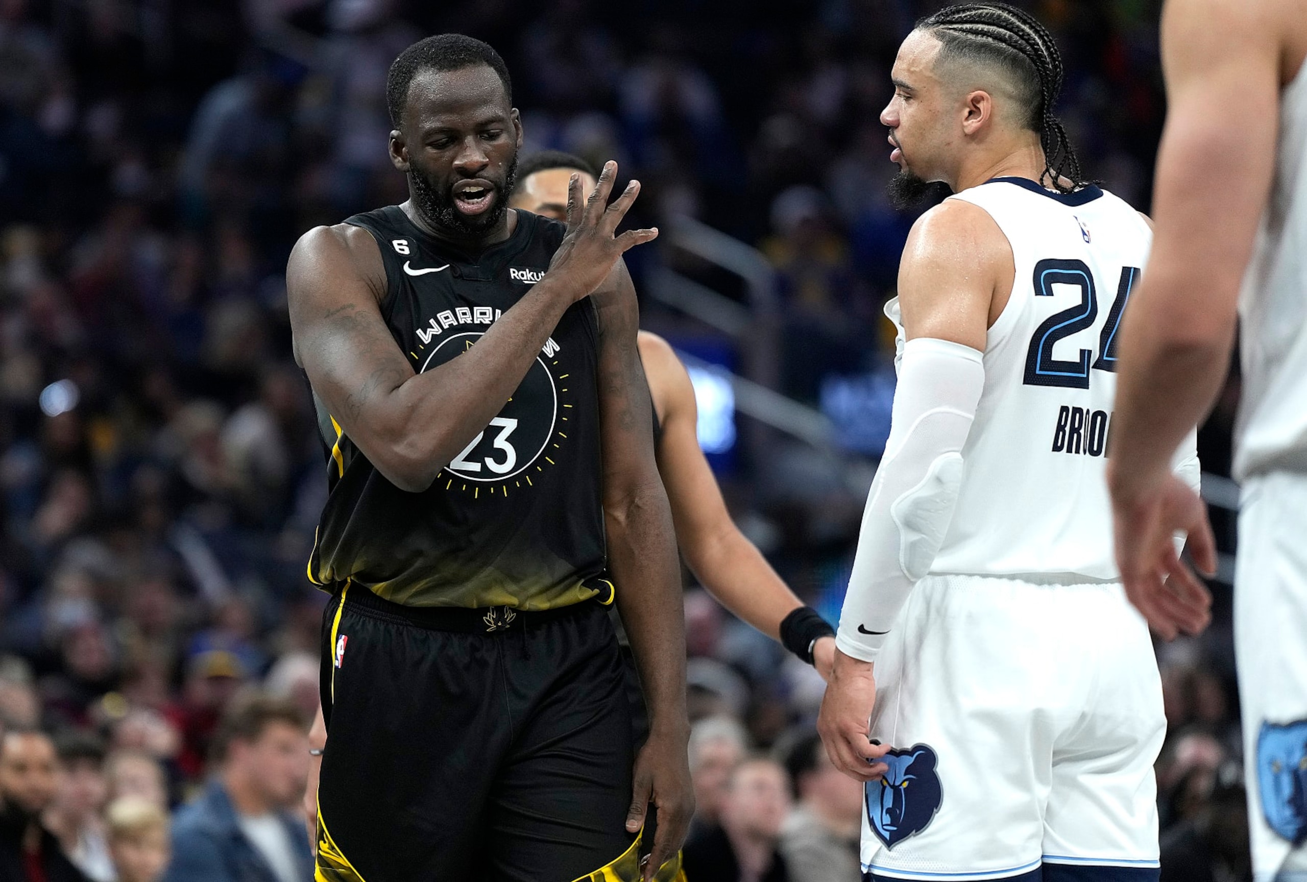 SAN FRANCISCO, CALIFORNIA - DECEMBER 25: Draymond Green #23 of the Golden State Warriors and Dillon Brooks #24 of the Memphis Grizzlies exchange word with each other during the second quarter at Chase Center on December 25, 2022 in San Francisco, California. NOTE TO USER: User expressly acknowledges and agrees that, by downloading and or using this photograph, User is consenting to the terms and conditions of the Getty Images License Agreement. (Photo by Thearon W. Henderson/Getty Images)