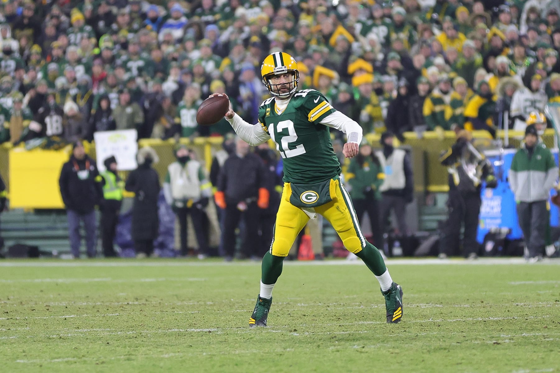 GREEN BAY, WISCONSIN - JANUARY 08: Aaron Rodgers #12 of the Green Bay Packers drops back to pass during a game against the Detroit Lions at Lambeau Field on January 08, 2023 in Green Bay, Wisconsin. The Lions defeated the Packers 20-16. (Photo by Stacy Revere/Getty Images)