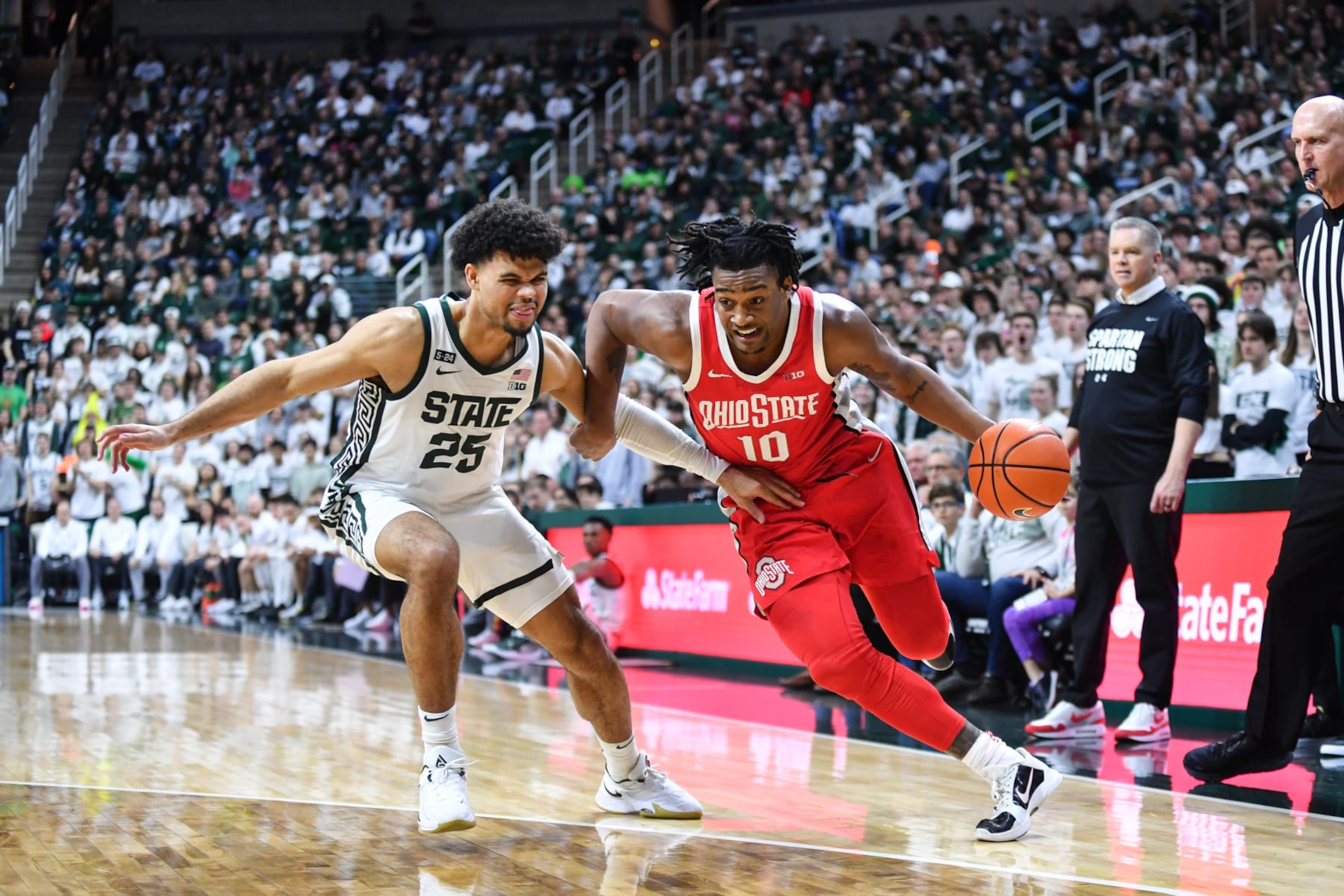 Ohio State's Brice Sensabaugh dribbles past Michigan State's Malik Hall