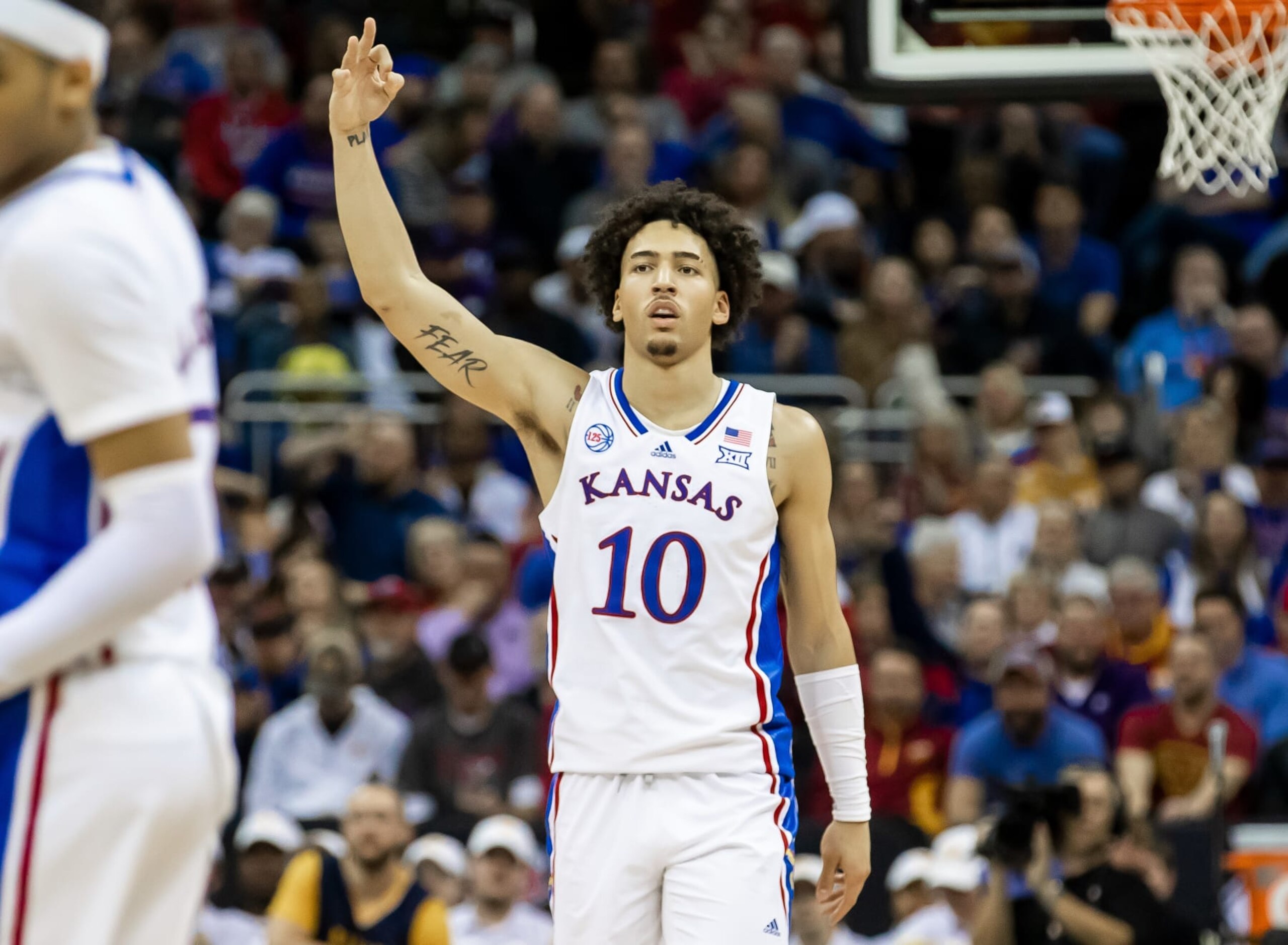 KANSAS CITY, MO - MARCH 09: Kansas forward Jalen Wilson (10) gestures a three after his successful shot during the Big12 Tournament game between the Kansas Jayhawks and the West Virginia Mountaineers on Thursday March 9, 2023 at the T-Mobile Center in Kansas City, MO.  (Photo by Nick Tre. Smith/Icon Sportswire via Getty Images)