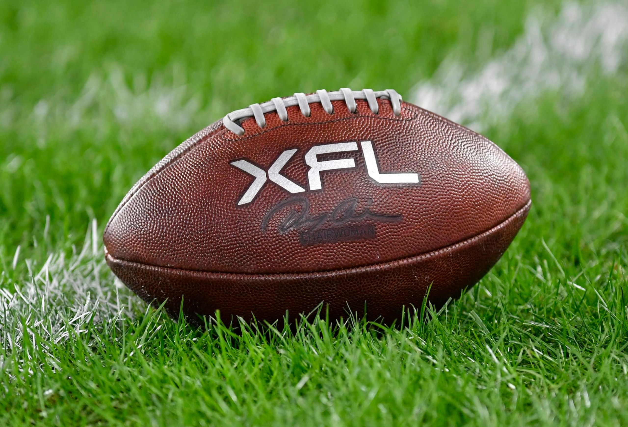 WASHINGTON, DC - FEBRUARY 19: A close up of an XFL leather game football on natural turf grass during the Seattle Sea Dragons versus D.C. Defenders XFL football game on February 19, 2023 at Audi Field in Washington, D.C.. (Photo by Randy Litzinger/Icon Sportswire via Getty Images)