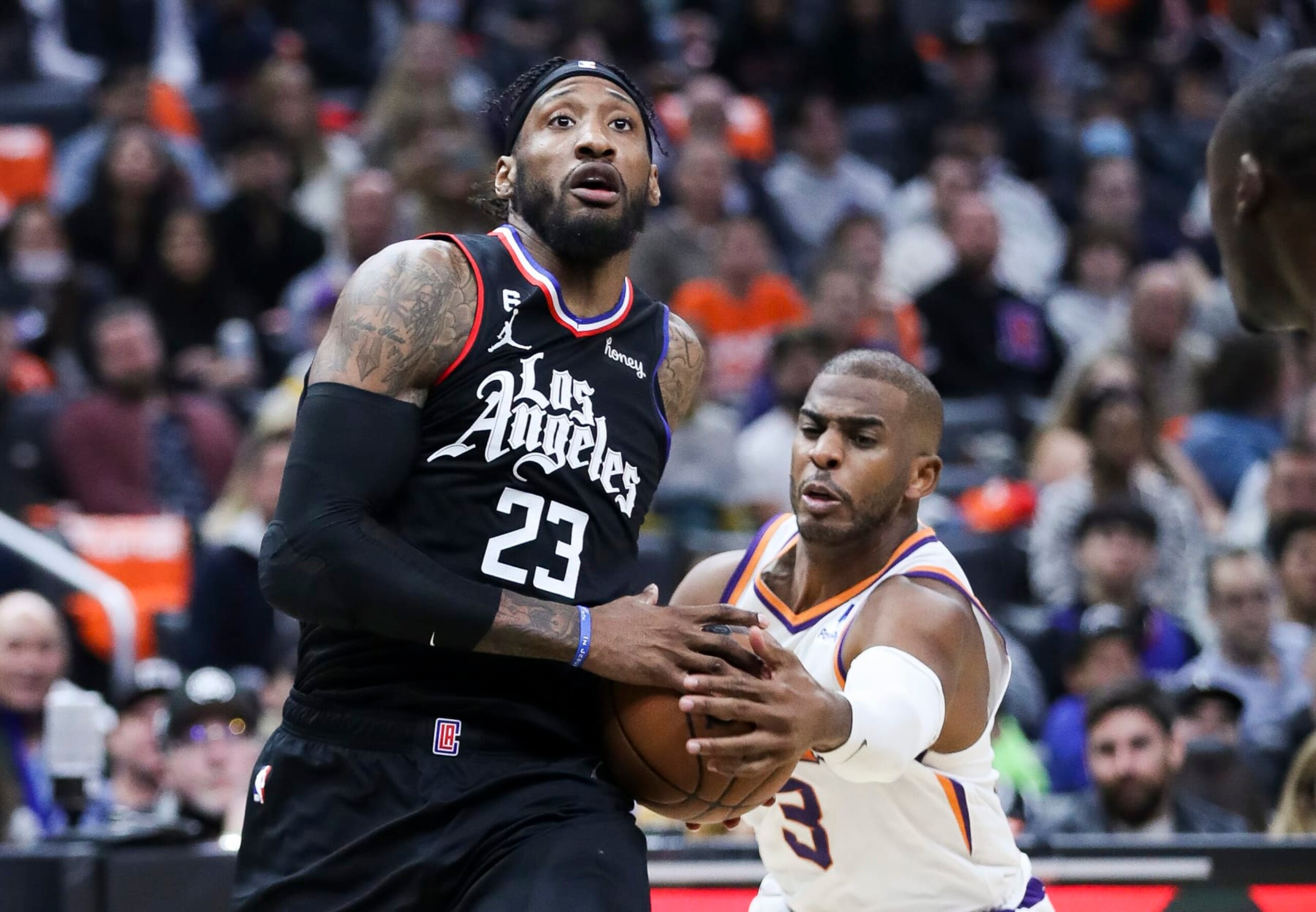 Los Angeles, CA - December 15: Phoenix Suns guard Chris Paul, right, lunges for the ball while LA Clippers forward Robert Covington drives to the basket during the second half at Crypto.com Arena on Thursday, Dec. 15, 2022 in Los Angeles, CA.(Allen J. Schaben / Los Angeles Times via Getty Images) Los Angeles, CA - December 15: Phoenix Suns guard Chris Paul, right, lunges for the ball while LA Clippers forward Robert Covington drives to the basket during the second half at Crypto.com Arena on Thursday, Dec. 15, 2022 in Los Angeles, CA.(Allen J. Schaben / Los Angeles Times via Getty Images)