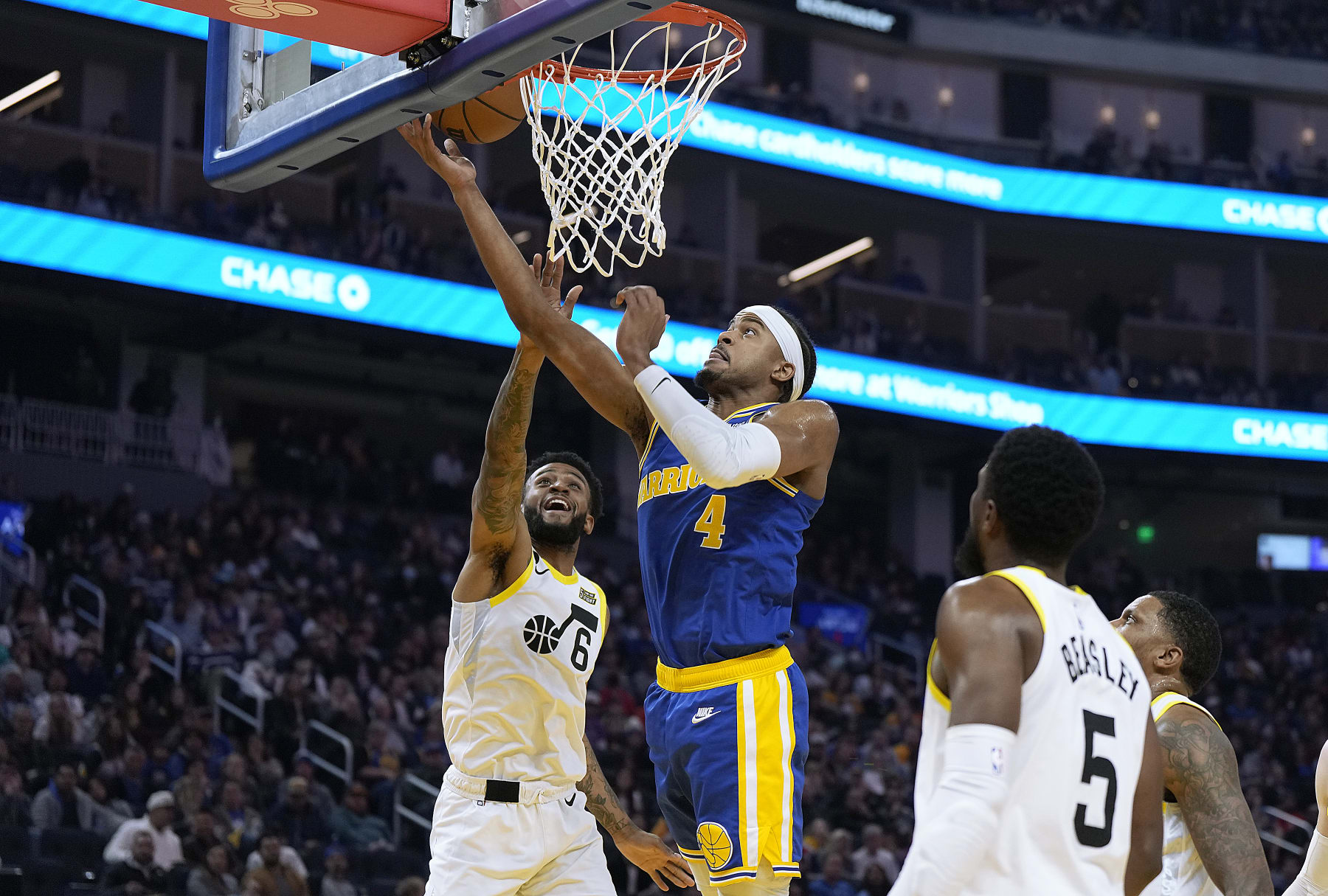 SAN FRANCISCO, CALIFORNIA - DECEMBER 28: Moses Moody #4 of the Golden State Warriors shoots and scores while getting fouled by Nickeil Alexander-Walker #6 of the Utah Jazz during the second quarter at Chase Center on December 28, 2022 in San Francisco, California. NOTE TO USER: User expressly acknowledges and agrees that, by downloading and or using this photograph, User is consenting to the terms and conditions of the Getty Images License Agreement. (Photo by Thearon W. Henderson/Getty Images)