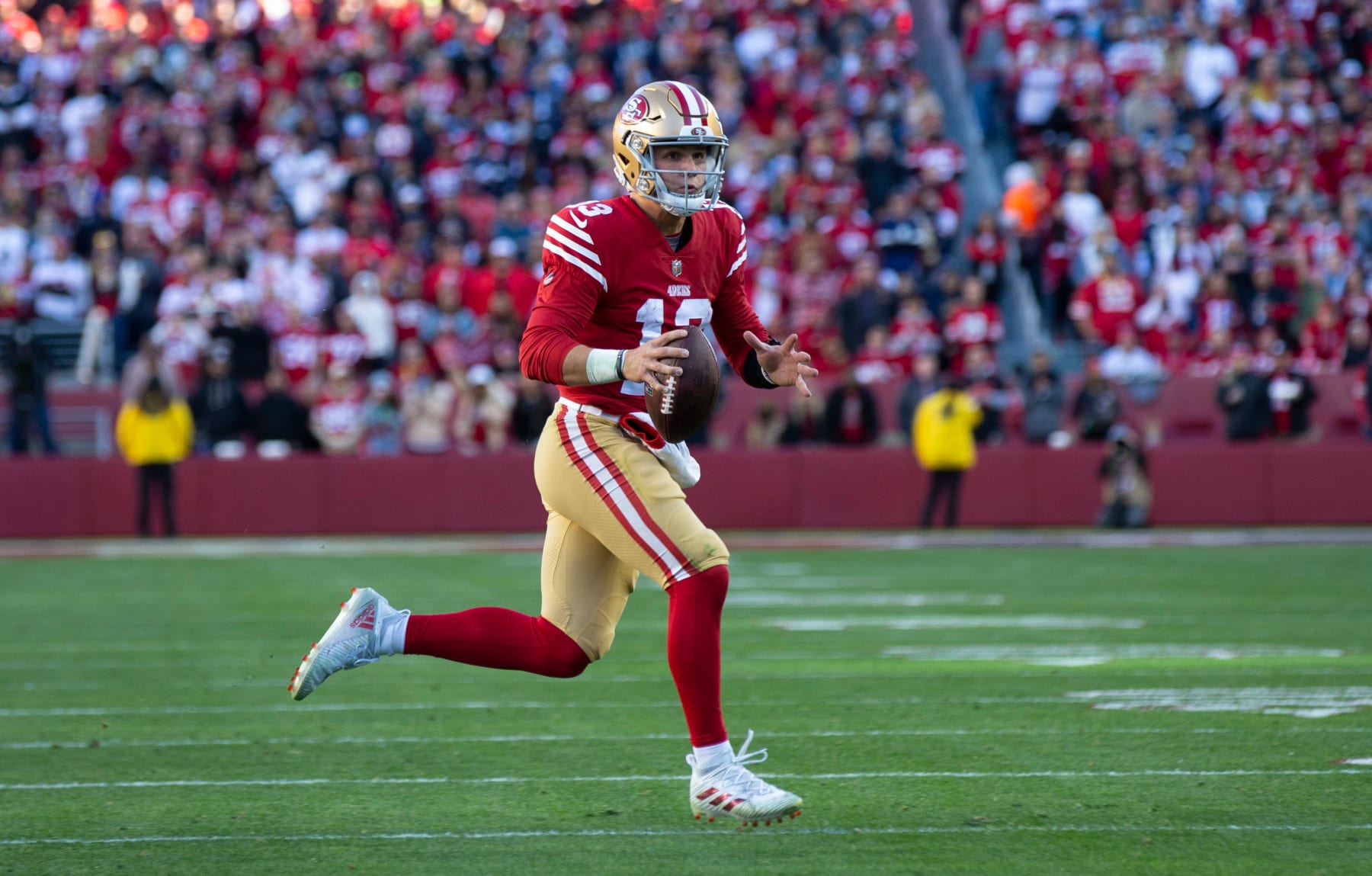 SANTA CLARA, CA - JANUARY 22: Brock Purdy #13 of the San Francisco 49ers looks for a receiver during the NFC Divisional playoff game against the Dallas Cowboys at Levi's Stadium on January 22, 2023 in Santa Clara, California. The 49ers defeated the Cowboys 19-12. (Photo by Michael Zagaris/San Francisco 49ers/Getty Images)