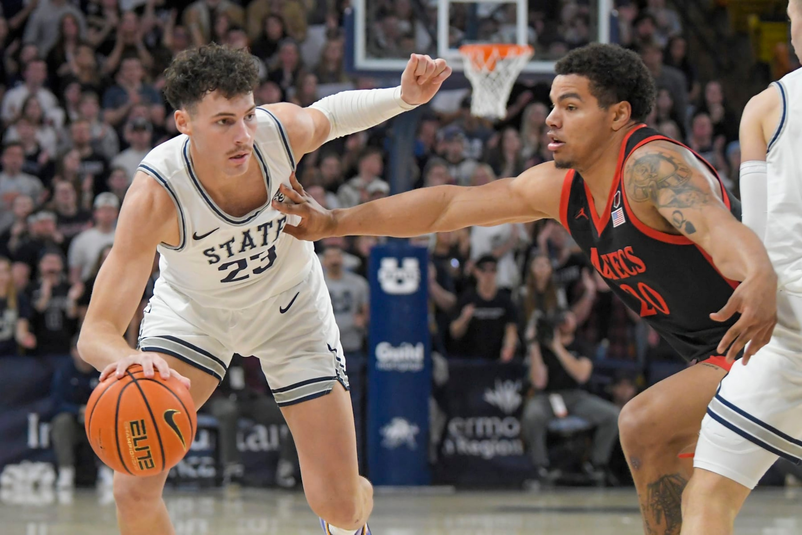Taylor Funk of Utah State (left)
