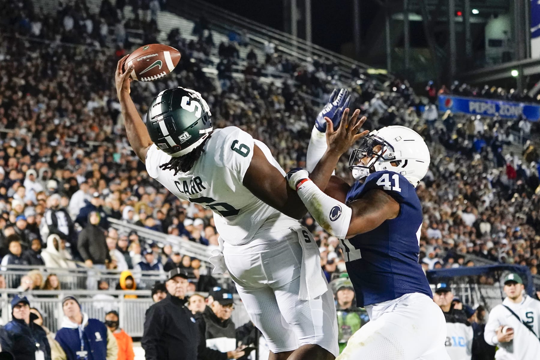 UNIVERSITY PARK, PA - NOVEMBER 26: Michigan State Spartans Tight End Maliq Carr (6) makes a one handed catch for a touchdown against Penn State Nittany Lions Linebacker Kobe King (41) during the second half of the college football game between the Michigan State Spartans and Penn State Nittany Lions on November 26,2022, at Beaver Stadium in University Park, PA. (Photo by Gregory Fisher/Icon Sportswire via Getty Images)