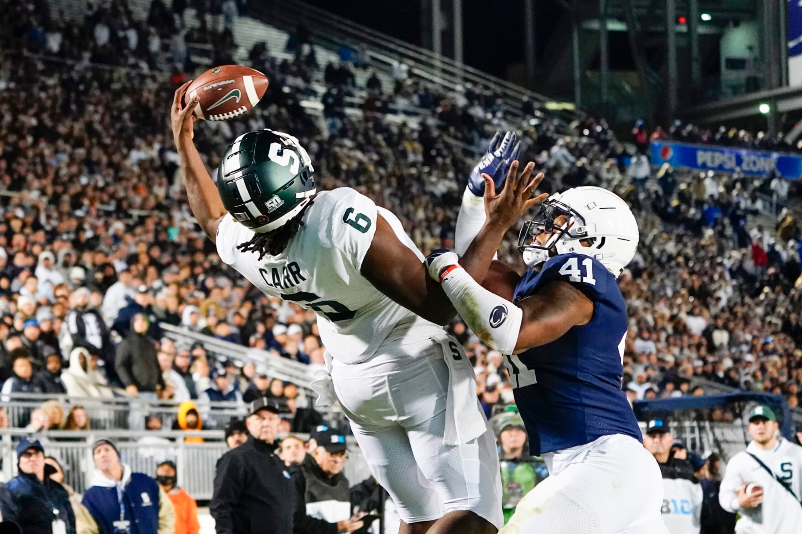 UNIVERSITY PARK, PA - NOVEMBER 26: Michigan State Spartans Tight End Maliq Carr (6) makes a one handed catch for a touchdown against Penn State Nittany Lions Linebacker Kobe King (41) during the second half of the college football game between the Michigan State Spartans and Penn State Nittany Lions on November 26,2022, at Beaver Stadium in University Park, PA. (Photo by Gregory Fisher/Icon Sportswire via Getty Images) UNIVERSITY PARK, PA - NOVEMBER 26: Michigan State Spartans Tight End Maliq Carr (6) makes a one handed catch for a touchdown against Penn State Nittany Lions Linebacker Kobe King (41) during the second half of the college football game between the Michigan State Spartans and Penn State Nittany Lions on November 26,2022, at Beaver Stadium in University Park, PA. (Photo by Gregory Fisher/Icon Sportswire via Getty Images)