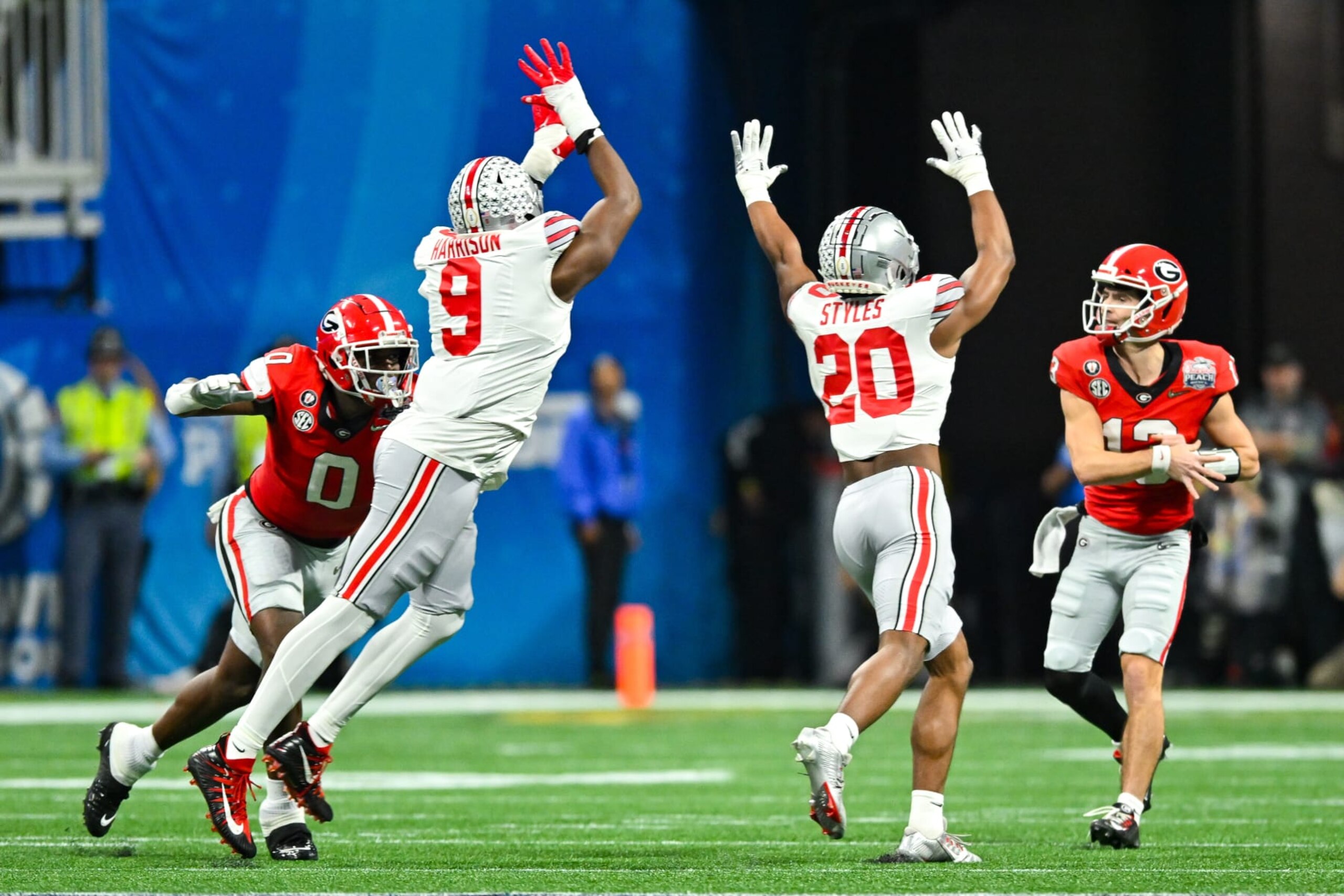 ATLANTA, GA DECEMBER 31: Ohio State defensive end Zach Harrison (9) and safety Sonny Styles (20) attempt to block the pass by Georgia quarterback Stetson Bennett (13) during the Chick-fil-A Peach Bowl college football playoff game between the Ohio State Buckeyes and the Georgia Bulldogs on December 31st, 2022 at Mercedes-Benz Stadium in Atlanta, GA. (Photo by Rich von Biberstein/Icon Sportswire via Getty Images) ATLANTA, GA DECEMBER 31: Ohio State defensive end Zach Harrison (9) and safety Sonny Styles (20) attempt to block the pass by Georgia quarterback Stetson Bennett (13) during the Chick-fil-A Peach Bowl college football playoff game between the Ohio State Buckeyes and the Georgia Bulldogs on December 31st, 2022 at Mercedes-Benz Stadium in Atlanta, GA. (Photo by Rich von Biberstein/Icon Sportswire via Getty Images)