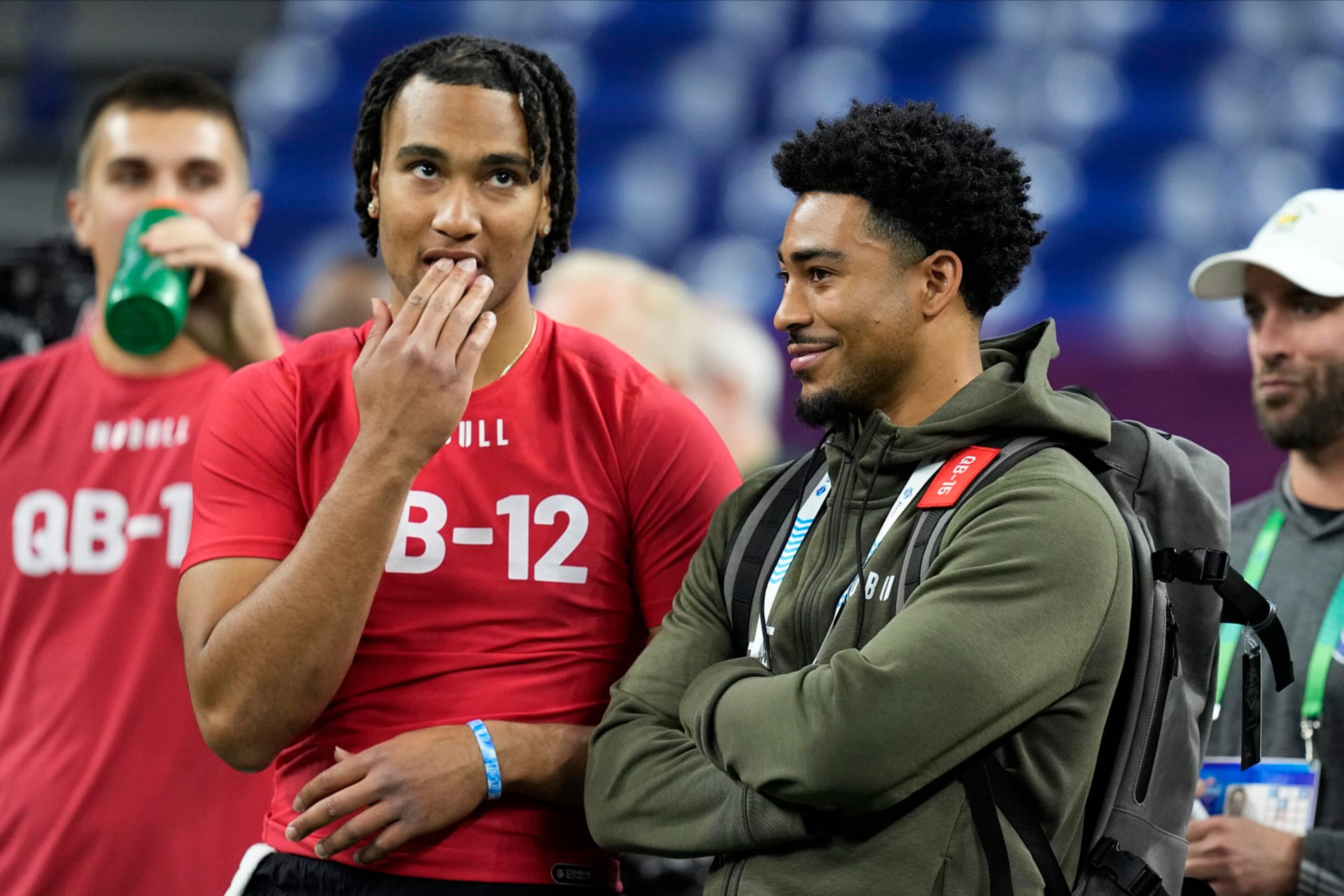 Ohio State quarterback CJ Stroud, left, talks to Alabama quarterback Bryce Young at the NFL football scouting combine in Indianapolis, Saturday, March 4, 2023. (AP Photo/Darron Cummings)