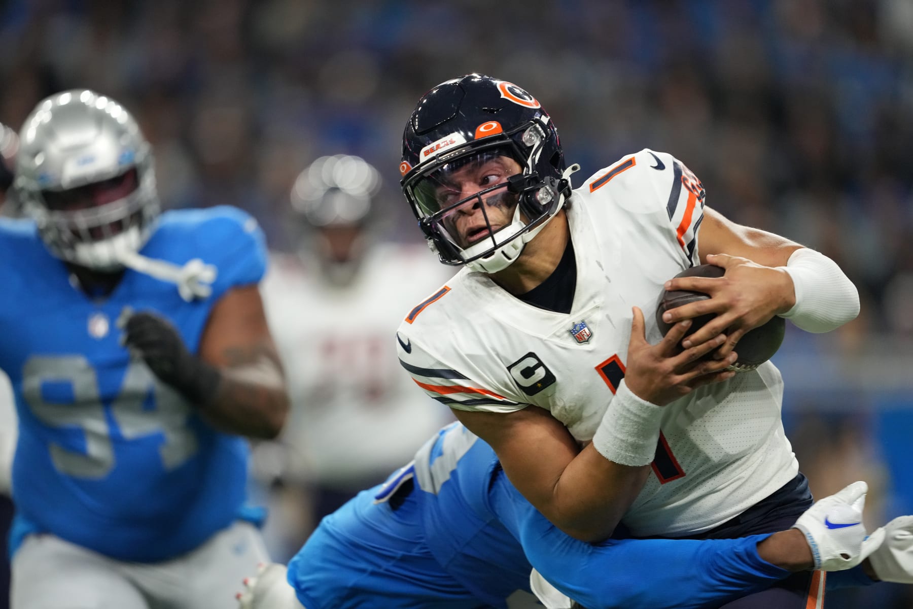 DETROIT, MICHIGAN - JANUARY 01: Justin Fields #1 of the Chicago Bears is sacked during the third quarter in the game against the Detroit Lions at Ford Field on January 01, 2023 in Detroit, Michigan. (Photo by Nic Antaya/Getty Images)