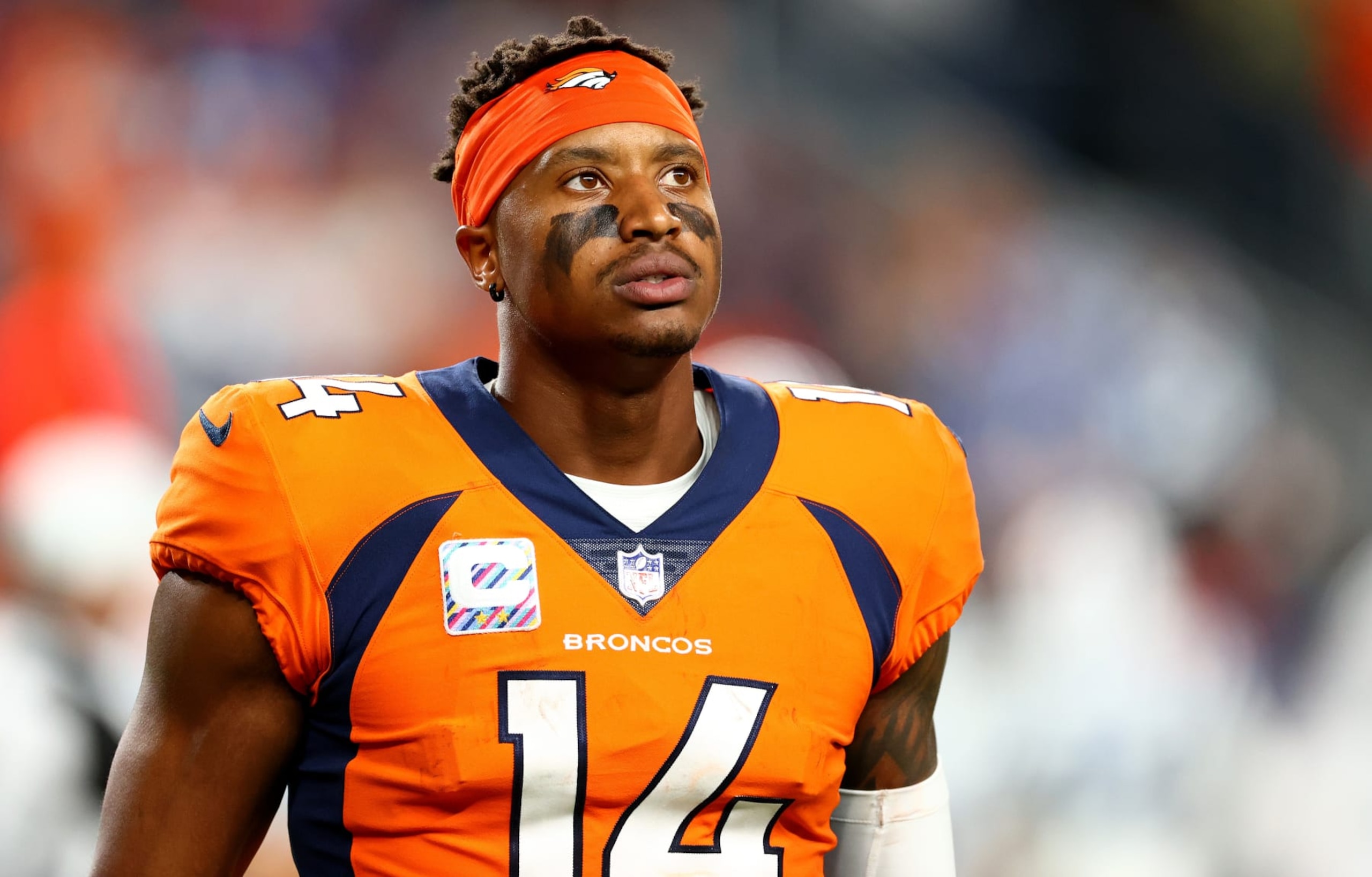 DENVER, COLORADO - OCTOBER 06: Courtland Sutton #14 of the Denver Broncos looks on during a game against the Indianapolis Colts at Empower Field At Mile High on October 06, 2022 in Denver, Colorado. (Photo by Justin Tafoya/Getty Images)