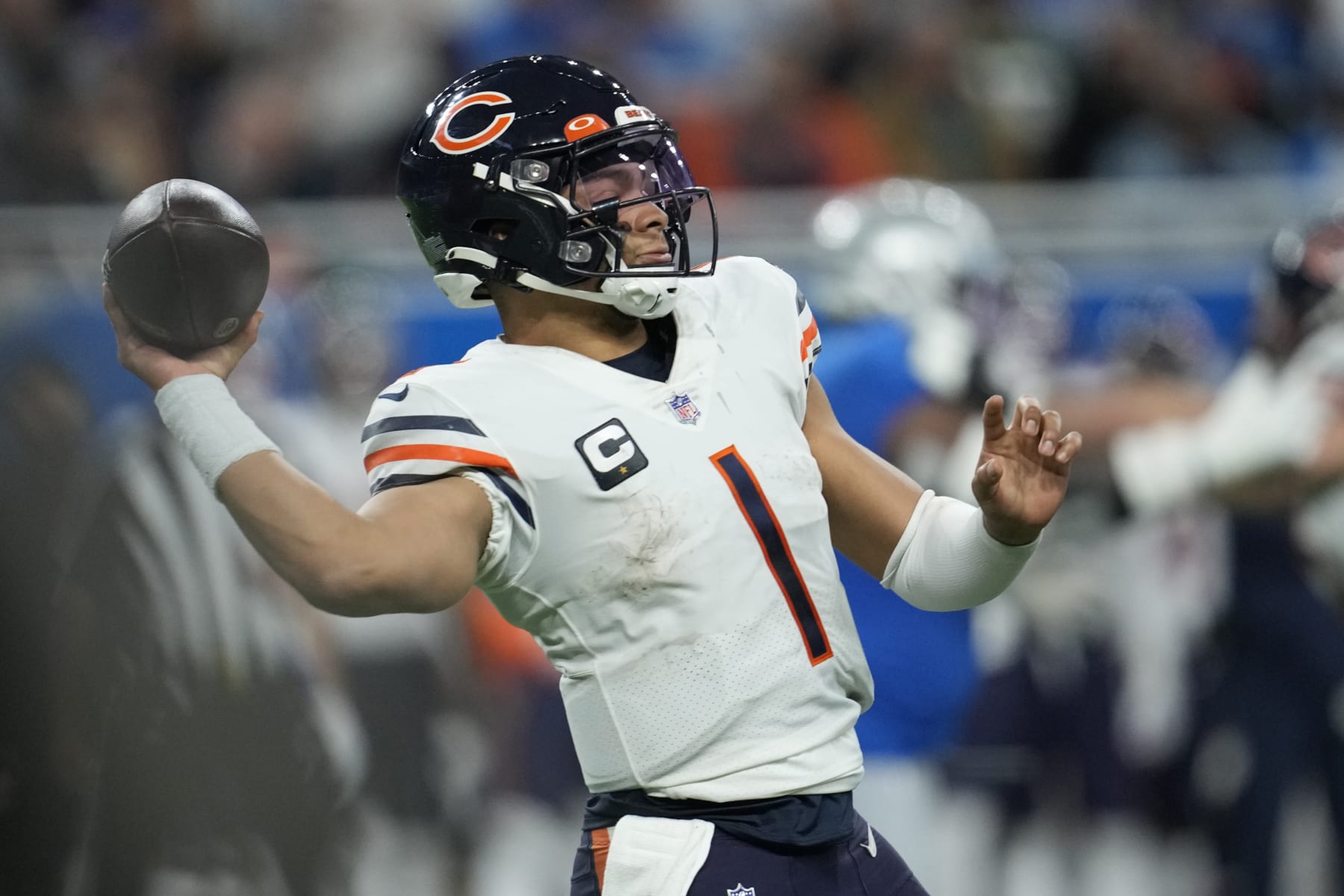 Chicago Bears quarterback Justin Fields throws during the second half of an NFL football game against the Detroit Lions, Sunday, Jan. 1, 2023, in Detroit. (AP Photo/Paul Sancya)