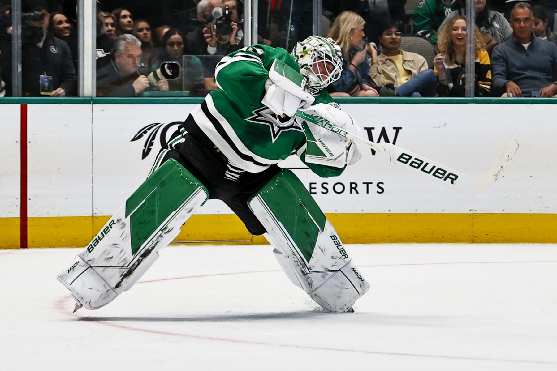 DALLAS, TX - FEBRUARY 14: Dallas Stars goaltender Jake Oettinger (29) passes the puck up the ice during the game between the Dallas Stars and the Boston Bruins on February 14, 2023 at American Airlines Center in Dallas, Texas. (Photo by Matthew Pearce/Icon Sportswire via Getty Images)