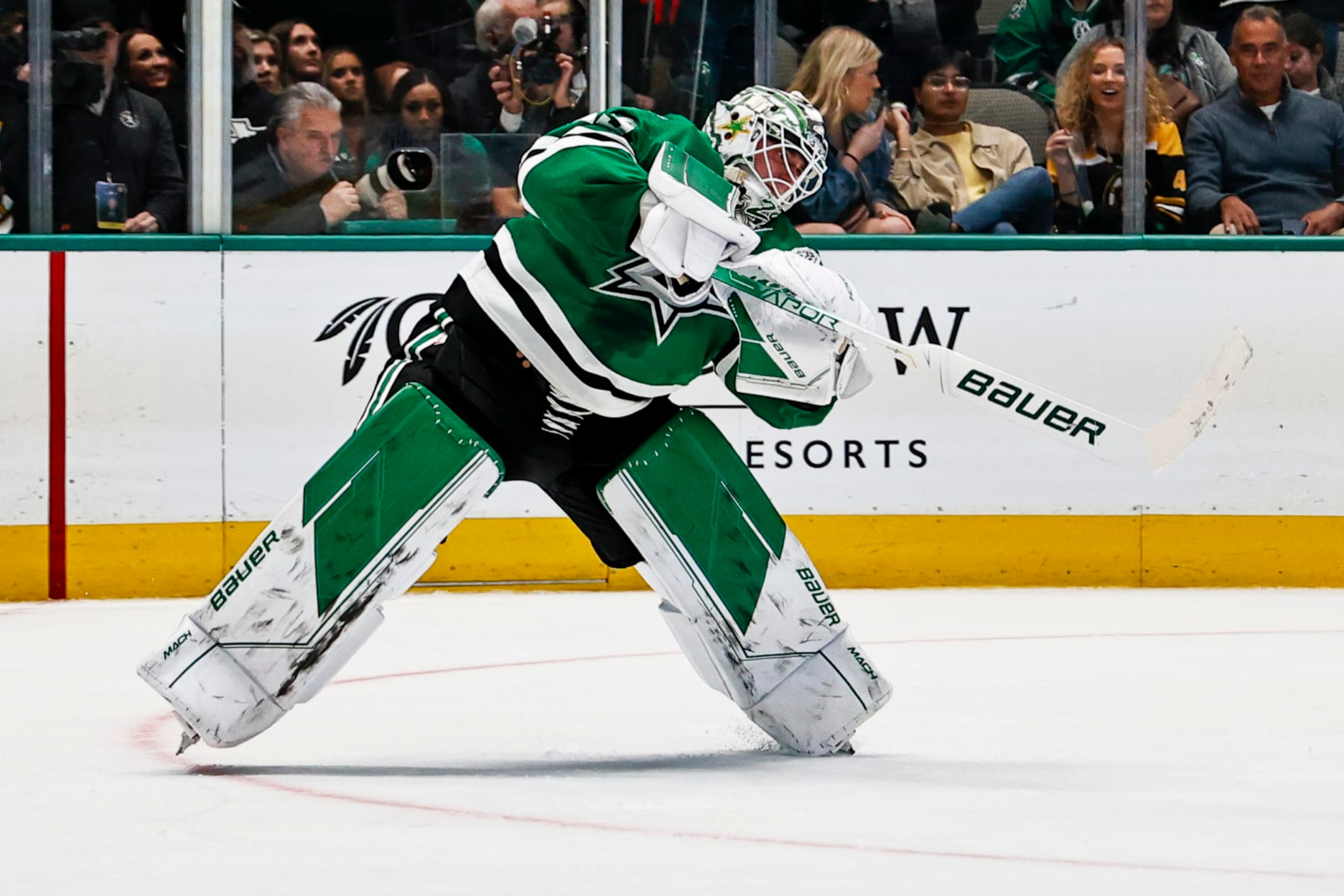 DALLAS, TX - FEBRUARY 14: Dallas Stars goaltender Jake Oettinger (29) passes the puck up the ice during the game between the Dallas Stars and the Boston Bruins on February 14, 2023 at American Airlines Center in Dallas, Texas. (Photo by Matthew Pearce/Icon Sportswire via Getty Images)