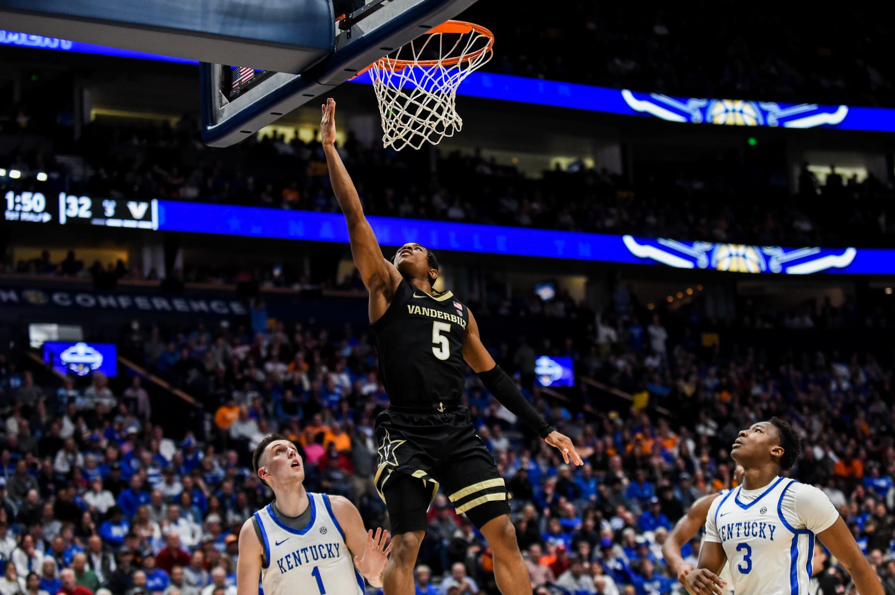 NASHVILLE, TENNESSEE - MARCH 10: Ezra Manjon #5 of the the Vanderbilt Commodores shoots the ball against the Kentucky Wildcats in the first half during the quarterfinals of the 2023 SEC Men's Basketball Tournament at Bridgestone Arena on March 10, 2023 in Nashville, Tennessee. (Photo by Carly Mackler/Getty Images)