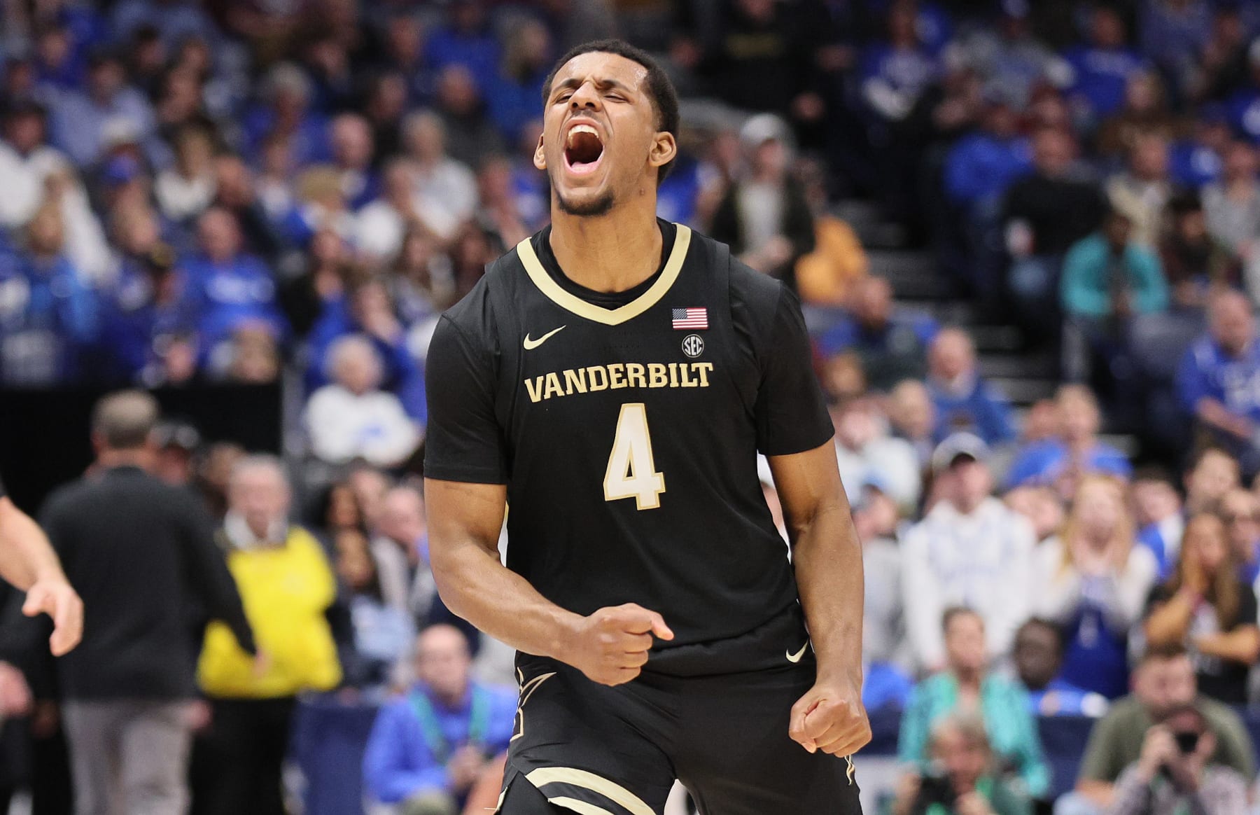 NASHVILLE, TENNESSEE - MARCH 10: Jordan Wright #4 of the Vanderbilt Commodores celebrates after hitting a three point shot to end the first half against the Kentucky Wildcats during the quarterfinals of the 2023 SEC Basketball Tournament on March 10, 2023 in Nashville, Tennessee. (Photo by Andy Lyons/Getty Images)