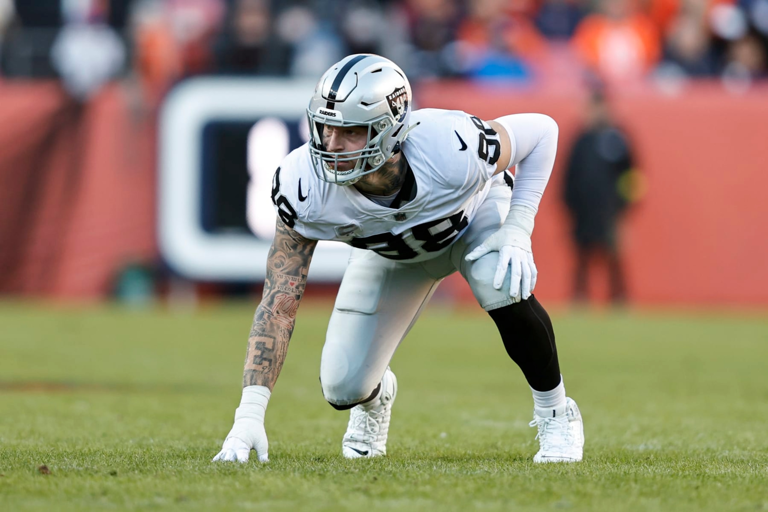 DENVER, COLORADO - NOVEMBER 20: Maxx Crosby #98 of the Las Vegas Raiders lines up during an NFL game between the Las Vegas Raiders and Denver Broncos at Empower Field At Mile High on November 20, 2022 in Denver, Colorado. The Las Vegas Raiders won in overtime (Photo by Michael Owens/Getty Images)