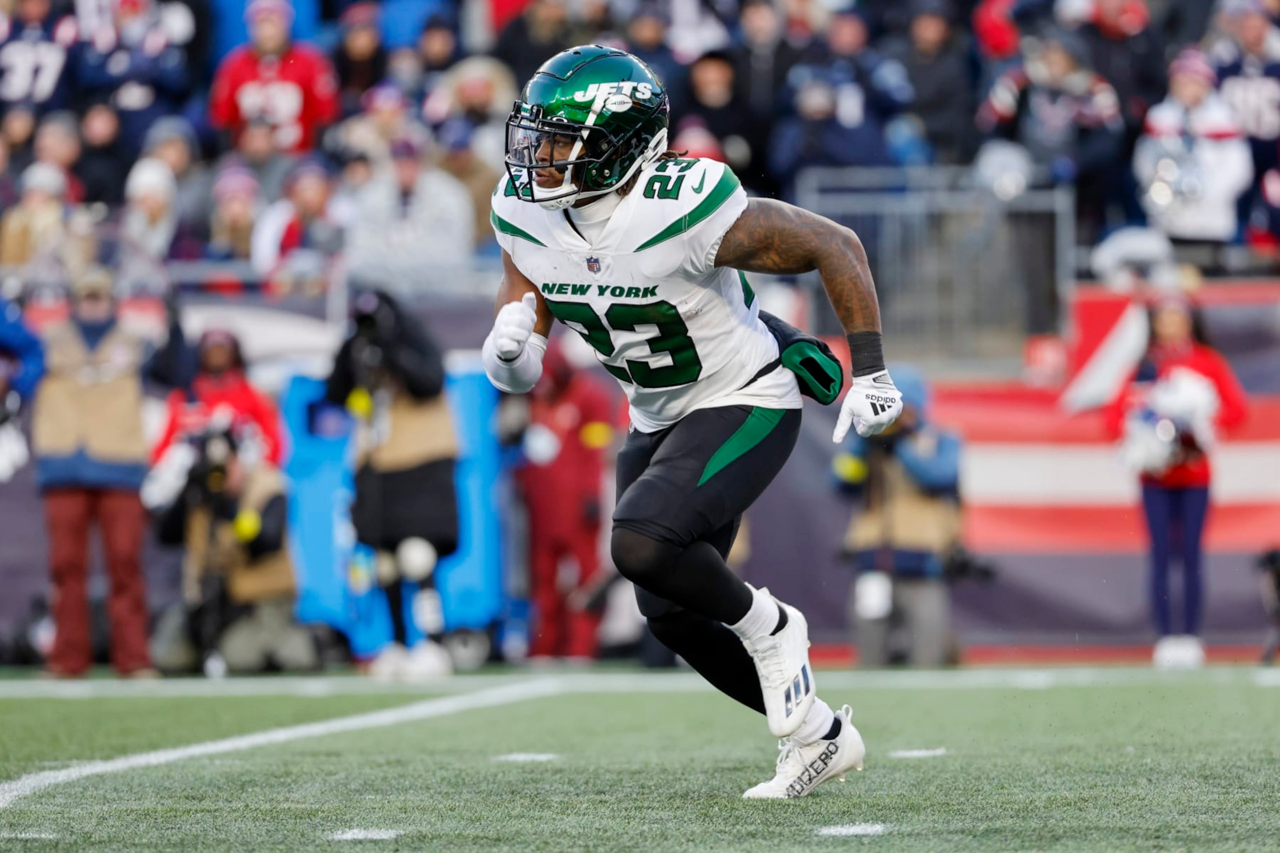 New York Jets running back James Robinson (23) runs during the second half of an NFL football game against the New England Patriots, Sunday, Nov. 20, 2022, in Foxborough, Mass. (AP Photo/Greg M. Cooper)