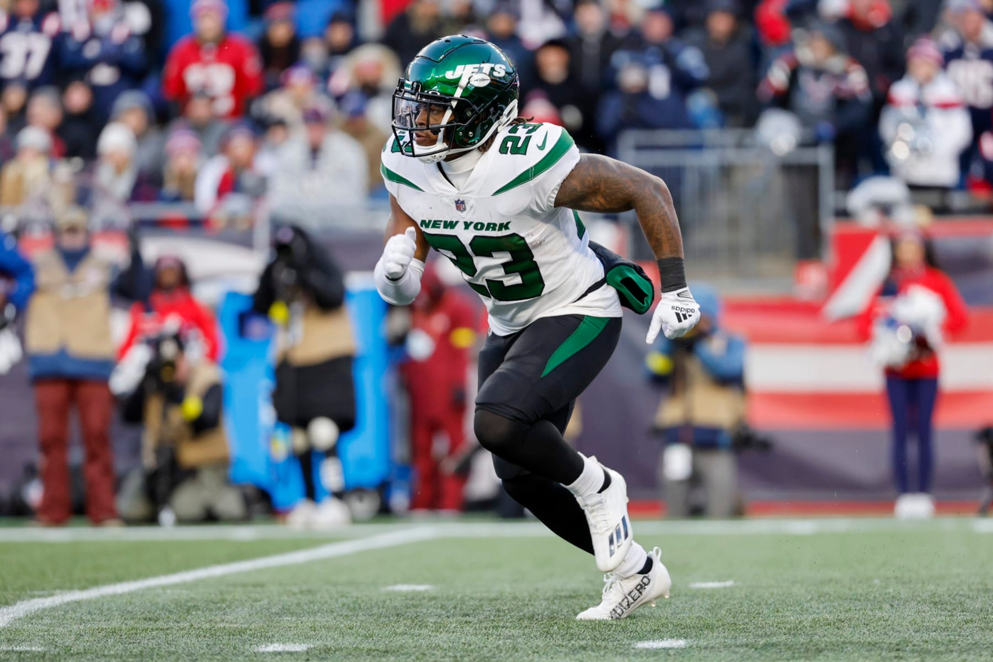 New York Jets running back James Robinson (23) runs during the second half of an NFL football game against the New England Patriots, Sunday, Nov. 20, 2022, in Foxborough, Mass. (AP Photo/Greg M. Cooper)