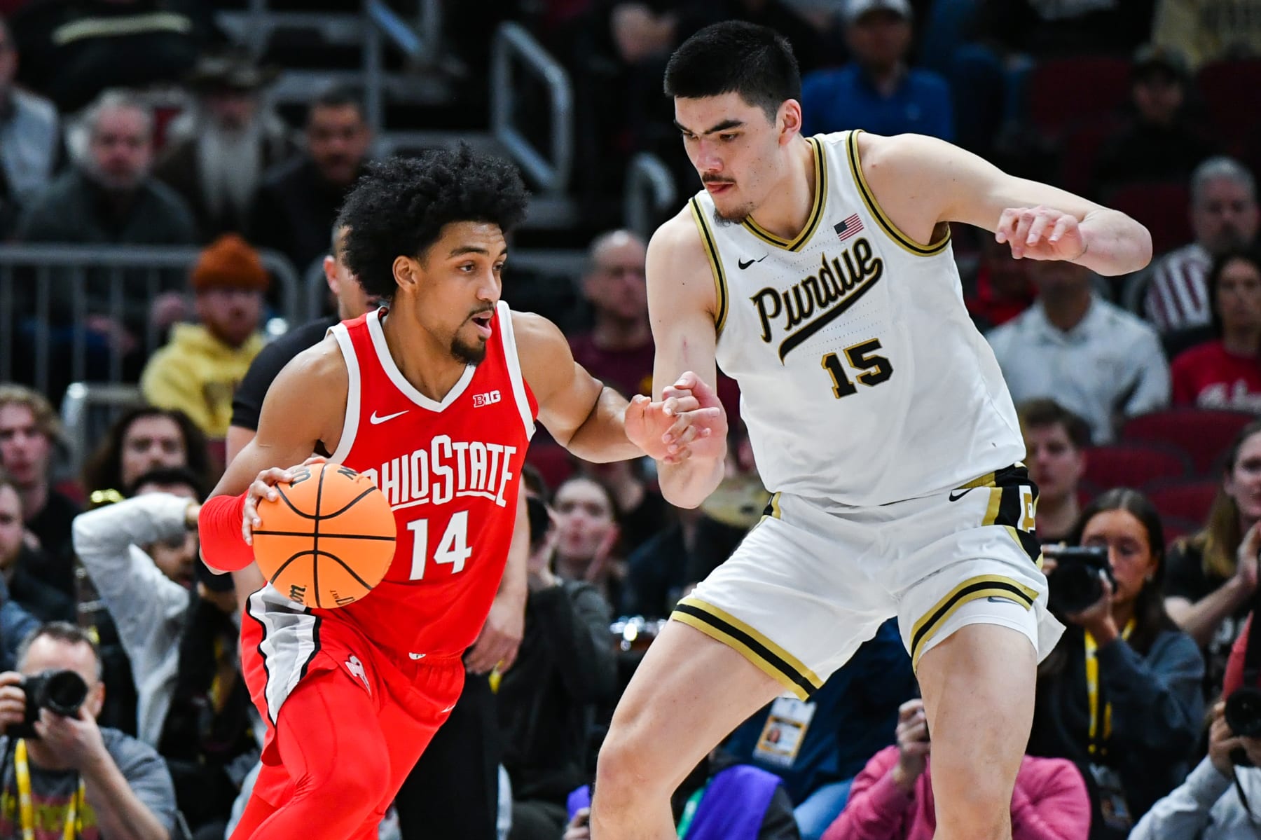 CHICAGO, ILLINOIS - MARCH 11:   Justice Sueing #14 of the Ohio State Buckeyes dribbles the ball around Zach Edey #15 of the Purdue Boilermakers during the first half of a Big Ten Men's Basketball Tournament Semifinals game at United Center on March 11, 2023 in Chicago, Illinois. (Photo by Aaron J. Thornton/Getty Images)