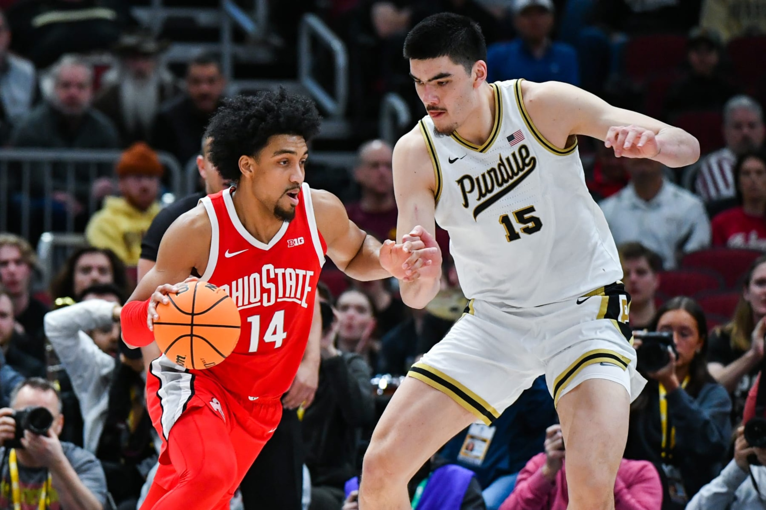 CHICAGO, ILLINOIS - MARCH 11:   Justice Sueing #14 of the Ohio State Buckeyes dribbles the ball around Zach Edey #15 of the Purdue Boilermakers during the first half of a Big Ten Men's Basketball Tournament Semifinals game at United Center on March 11, 2023 in Chicago, Illinois. (Photo by Aaron J. Thornton/Getty Images)