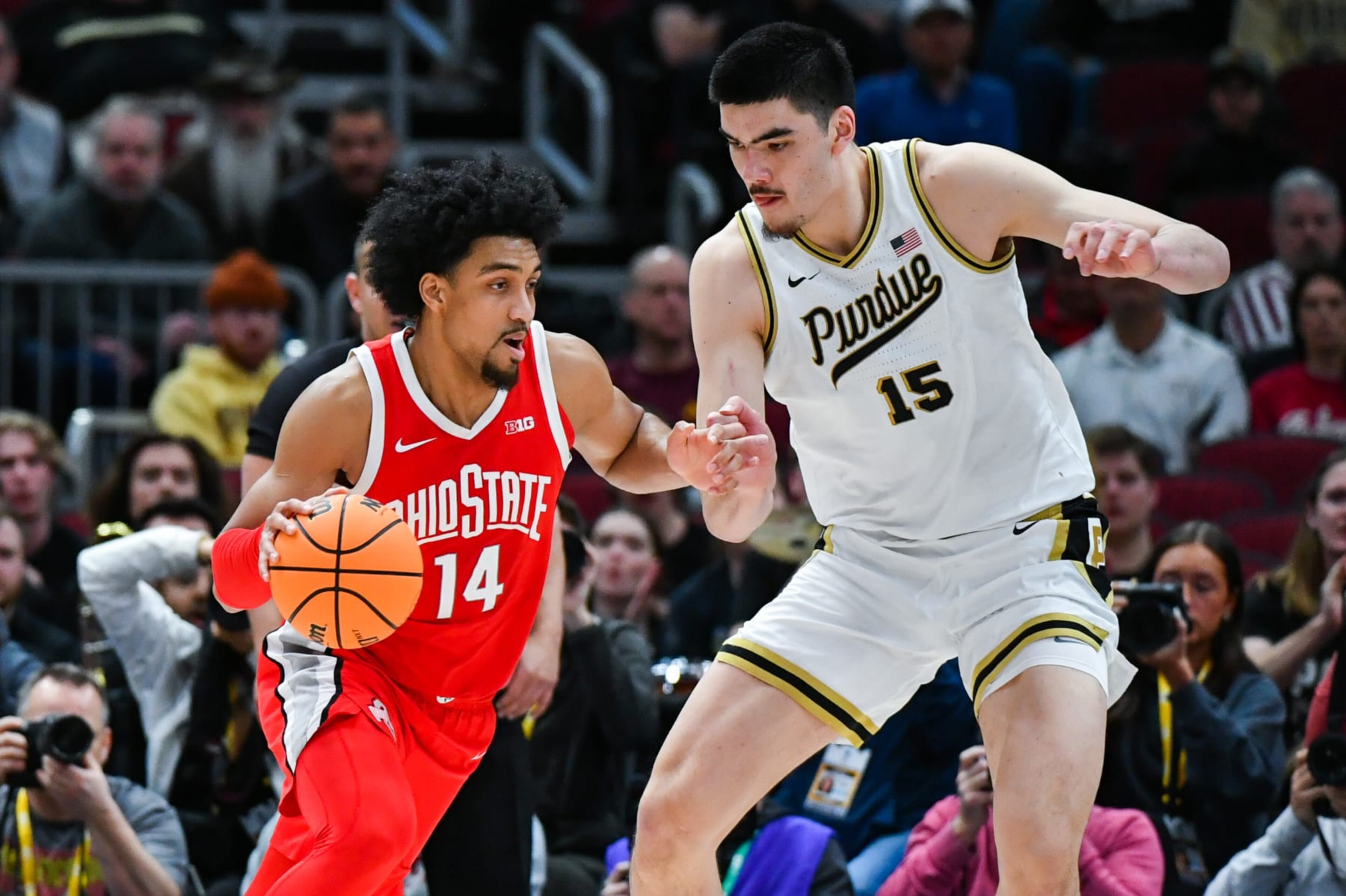 CHICAGO, ILLINOIS - MARCH 11:   Justice Sueing #14 of the Ohio State Buckeyes dribbles the ball around Zach Edey #15 of the Purdue Boilermakers during the first half of a Big Ten Men's Basketball Tournament Semifinals game at United Center on March 11, 2023 in Chicago, Illinois. (Photo by Aaron J. Thornton/Getty Images)