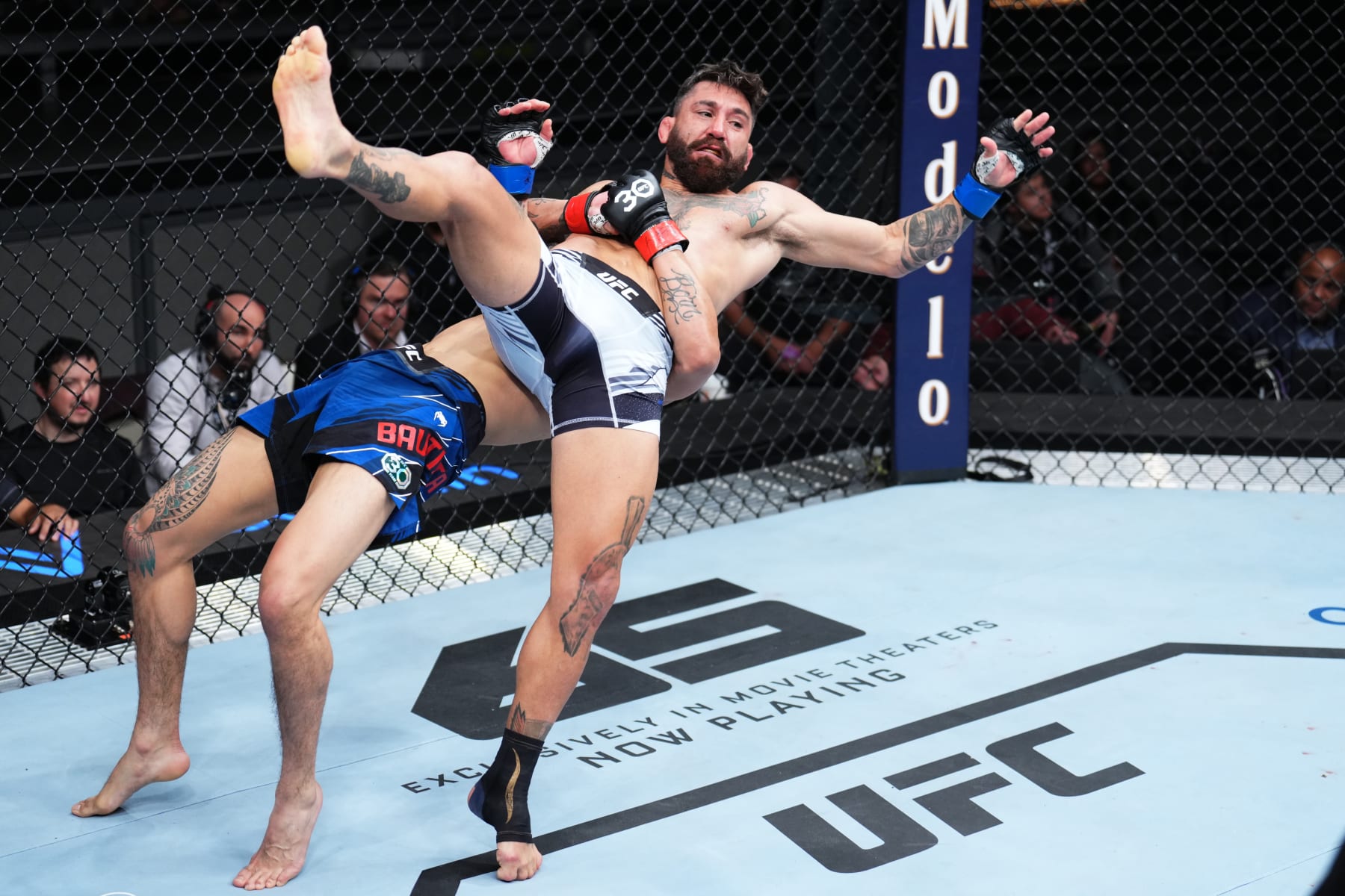 LAS VEGAS, NEVADA - MARCH 11: (L-R) Mario Bautista takes down Guido Cannetti of Argentina in a bantamweight fight during the UFC Fight Night event at The Theater at Virgin Hotels Las Vegas on March 11, 2023 in Las Vegas, Nevada. (Photo by Chris Unger/Zuffa LLC via Getty Images)