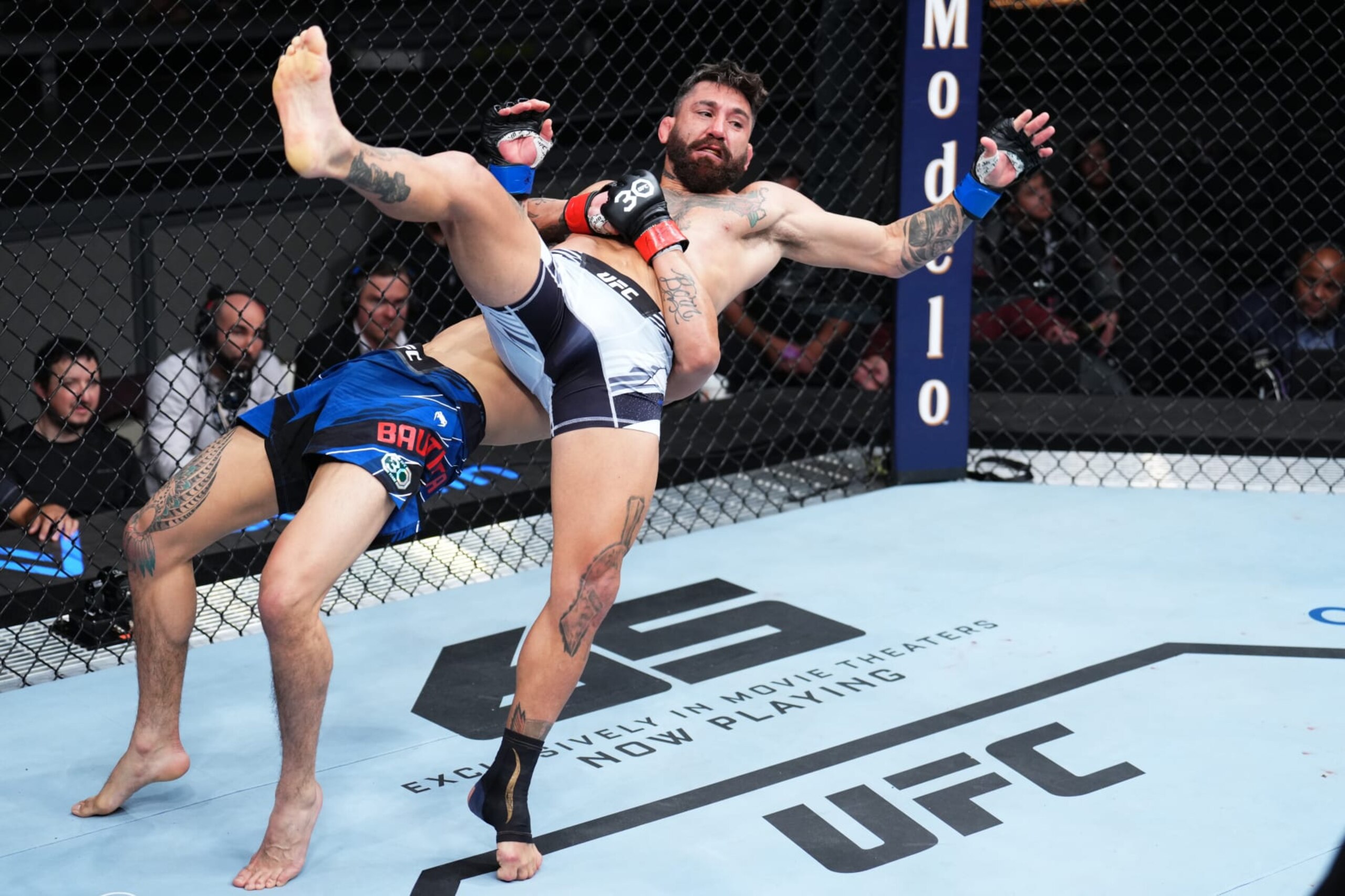 LAS VEGAS, NEVADA - MARCH 11: (L-R) Mario Bautista takes down Guido Cannetti of Argentina in a bantamweight fight during the UFC Fight Night event at The Theater at Virgin Hotels Las Vegas on March 11, 2023 in Las Vegas, Nevada. (Photo by Chris Unger/Zuffa LLC via Getty Images)
