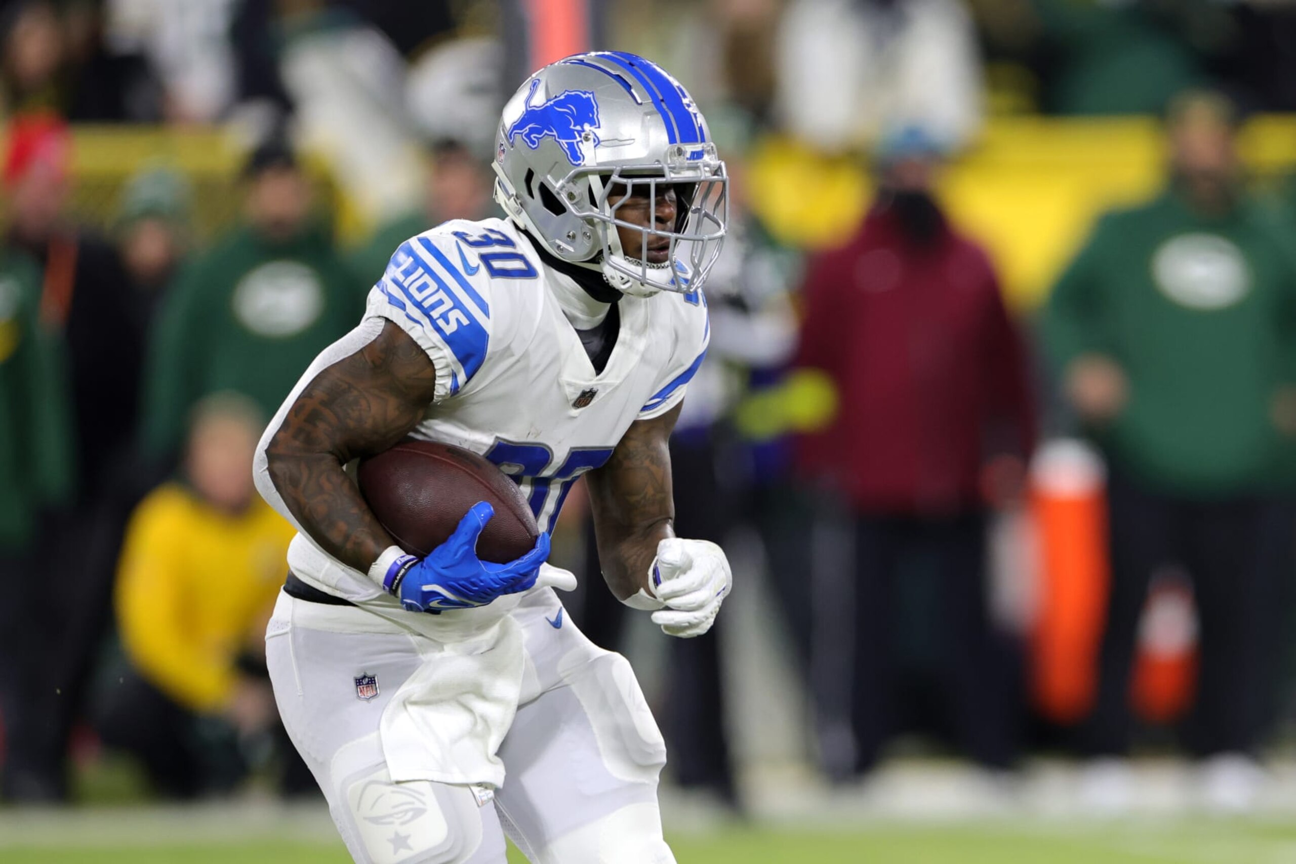 GREEN BAY, WISCONSIN - JANUARY 08: Jamaal Williams #30 of the Detroit Lions rushes during the first quarter against the Green Bay Packers at Lambeau Field on January 08, 2023 in Green Bay, Wisconsin. (Photo by Stacy Revere/Getty Images) GREEN BAY, WISCONSIN - JANUARY 08: Jamaal Williams #30 of the Detroit Lions rushes during the first quarter against the Green Bay Packers at Lambeau Field on January 08, 2023 in Green Bay, Wisconsin. (Photo by Stacy Revere/Getty Images)