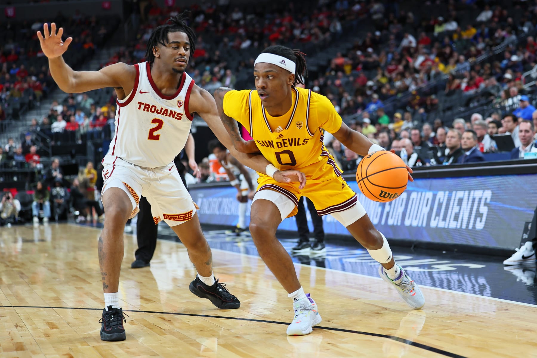 LAS VEGAS, NEVADA - MARCH 09: DJ Horne #0 of the Arizona State Sun Devils handles the ball against Reese Dixon-Waters #2 of the USC Trojans in the first half of a quarterfinal game of the Pac-12 basketball tournament at T-Mobile Arena on March 09, 2023 in Las Vegas, Nevada. (Photo by Leon Bennett/Getty Images)