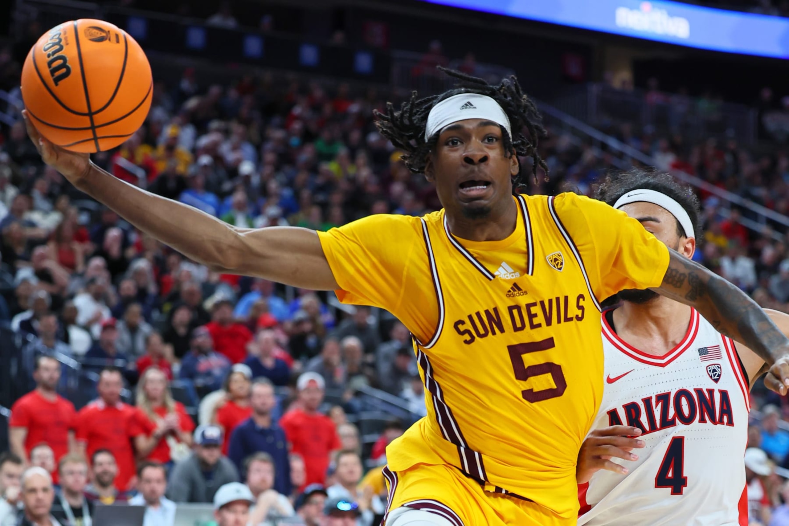 LAS VEGAS, NEVADA - MARCH 10: Jamiya Neal #5 of the Arizona State Sun Devils handles the ball against Kylan Boswell #4 of the Arizona Wildcats in the first half of a semifinal game of the Pac-12 basketball tournament at T-Mobile Arena on March 10, 2023 in Las Vegas, Nevada. (Photo by Leon Bennett/Getty Images)