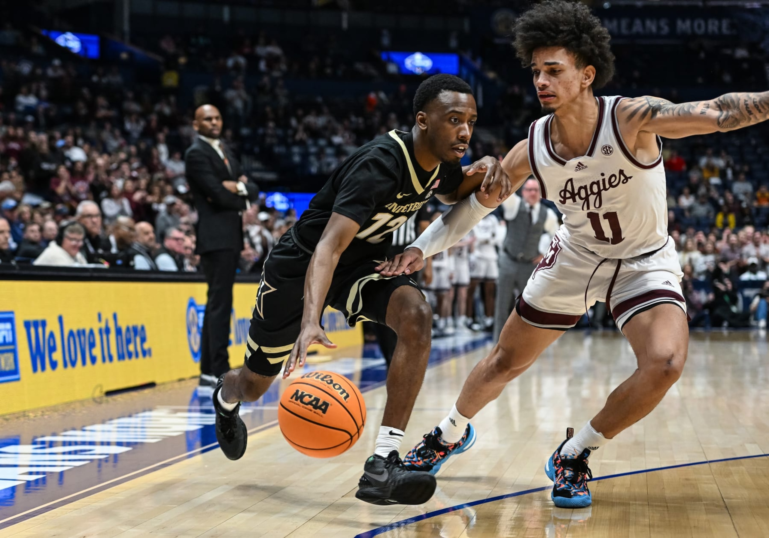 NASHVILLE, TN - MARCH 11: Vanderbilt Commodores guard Trey Thomas (12) drives around Texas A&M Aggies forward Andersson Garcia (11) during an SEC Mens Basketball Tournament game between the Texas A&M Aggies and the Vanderbilt Commodores on March 11, 2023 at Bridgestone Arena in Nashville, TN. (Photo by Bryan Lynn/Icon Sportswire via Getty Images)